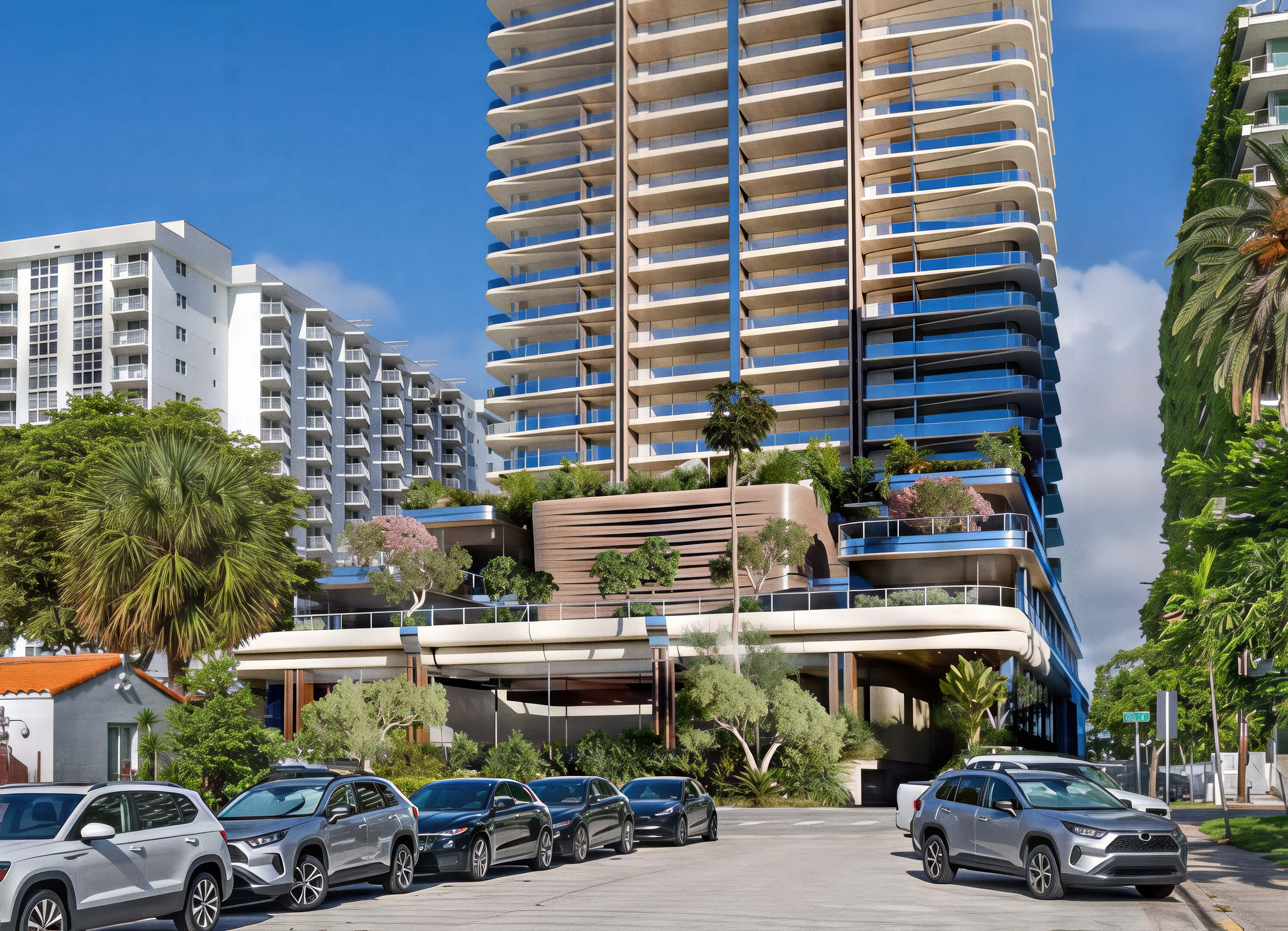 Street view of 1250 West Avenue Residences with curved balconies, landscaped terraces, and an entrance canopy.