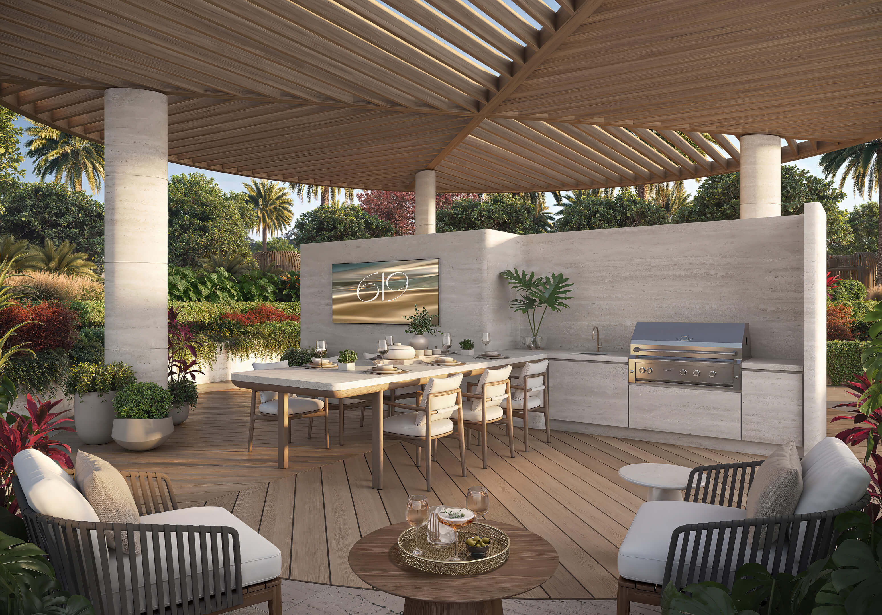 Outdoor summer kitchen and dining area at 619 Brickell Residences with covered terrace, grill, and tropical landscaping