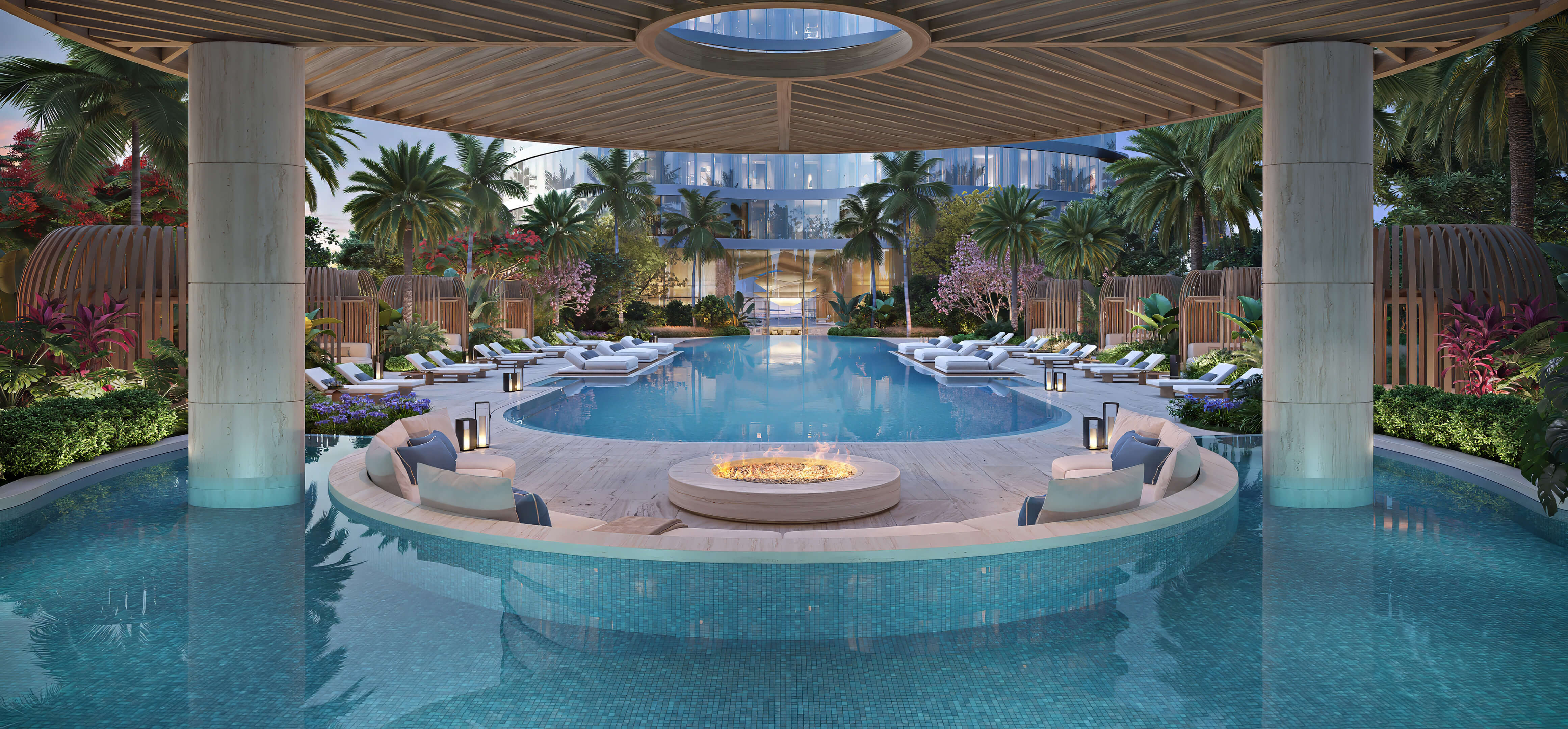 Pool fire pit lounge at 619 Brickell Residences with water features, cabanas, and tropical landscaping