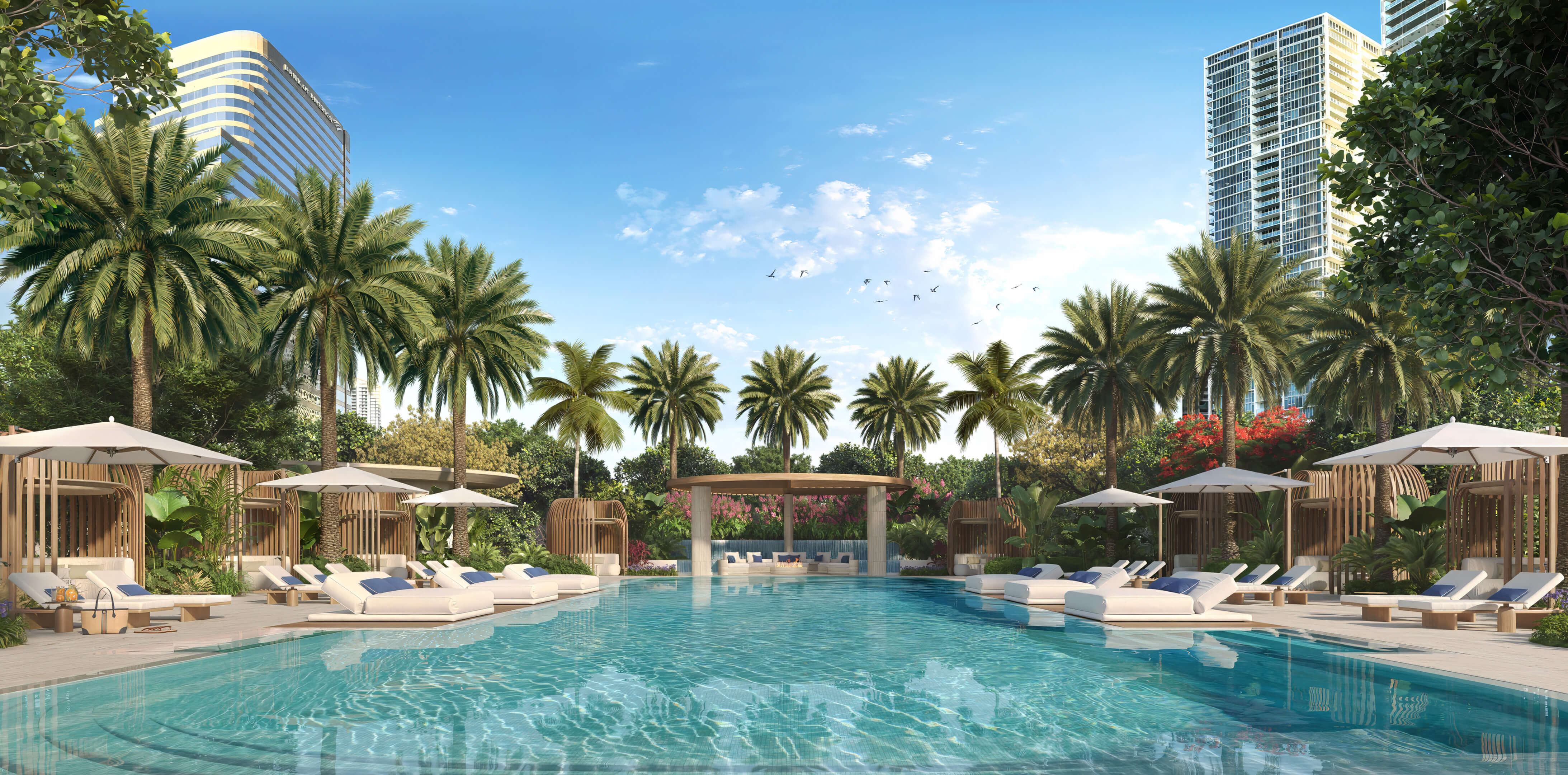 Resort pool deck at 619 Brickell Residences with palm landscaping, cabanas, and luxury lounge chairs