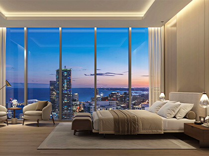 Luxury bedroom at 619 Brickell Residences with sunset skyline views and modern interior design