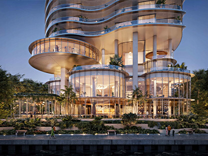 Luxury waterfront podium at 619 Brickell Residences with illuminated architecture and tropical landscaping
