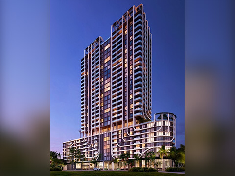 Night view of Anatomia Miami Residences with illuminated windows and contemporary tower architecture