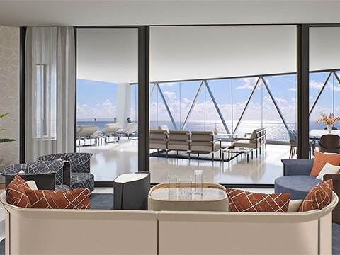 Bentley Residences living room opening onto a furnished terrace