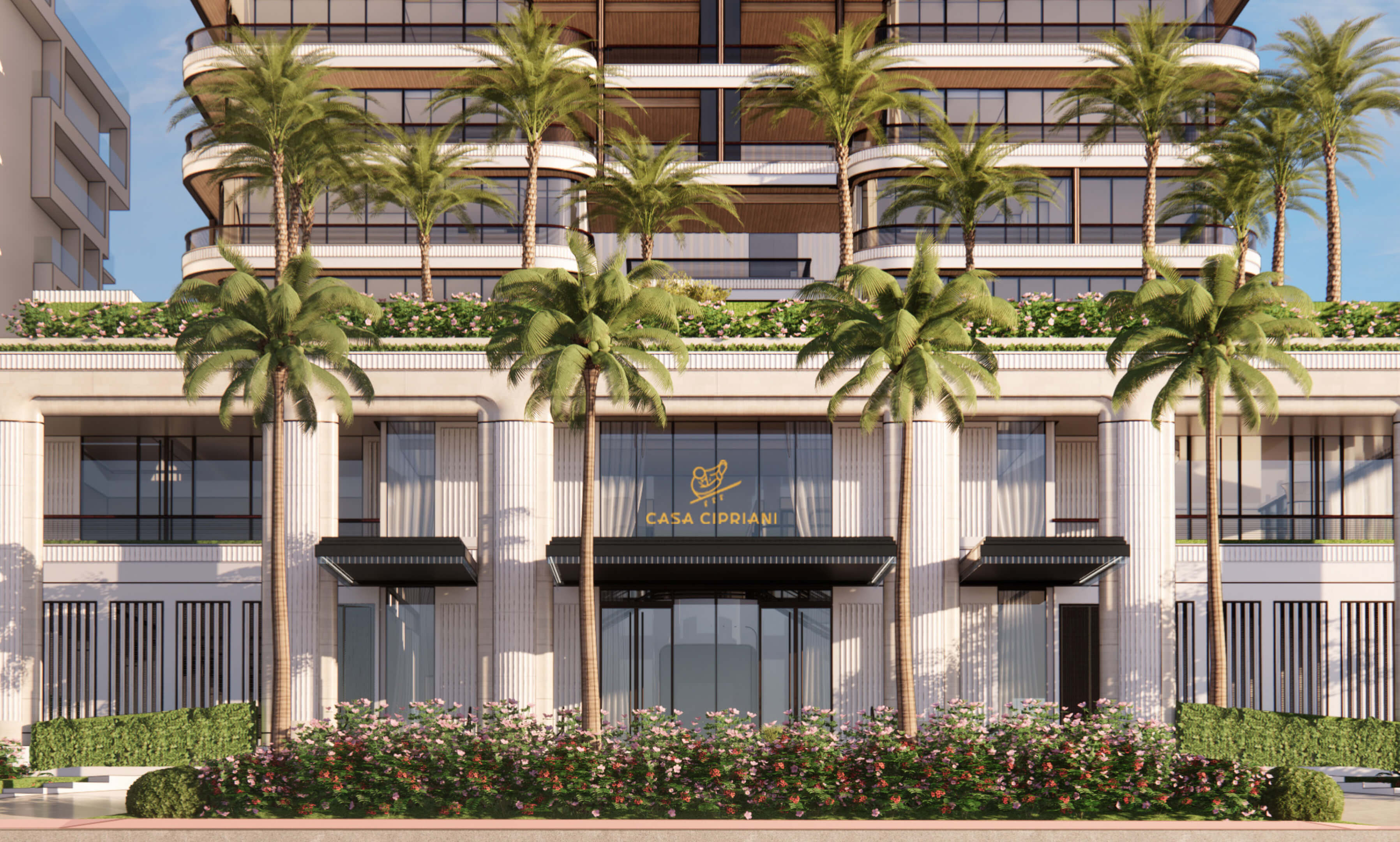 View of Casa Cipriani Miami Beach entrance featuring the gold logo and palm trees.