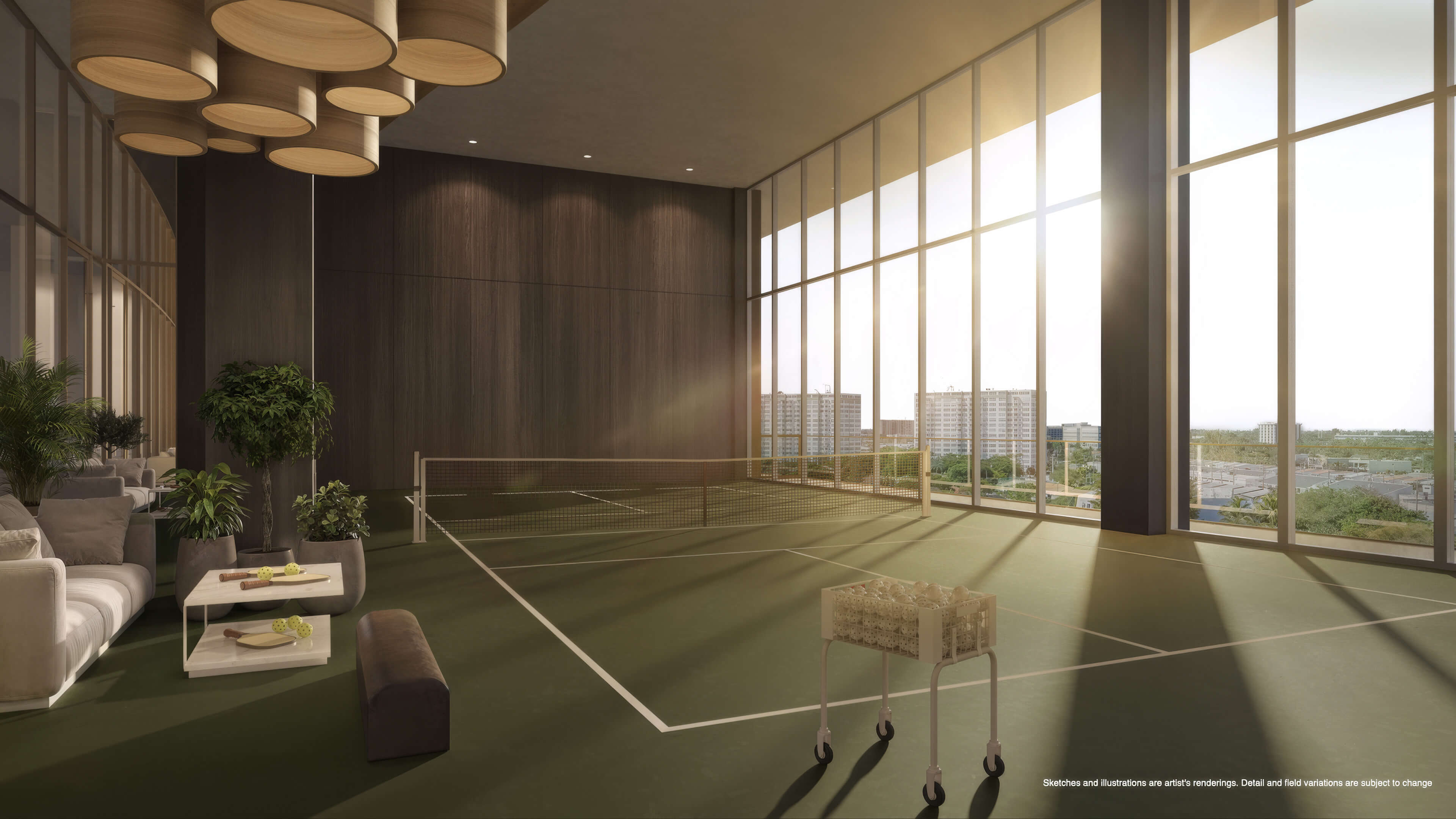 Indoor pickleball court at Continuum 12000 North Miami with floor-to-ceiling windows and lounge seating