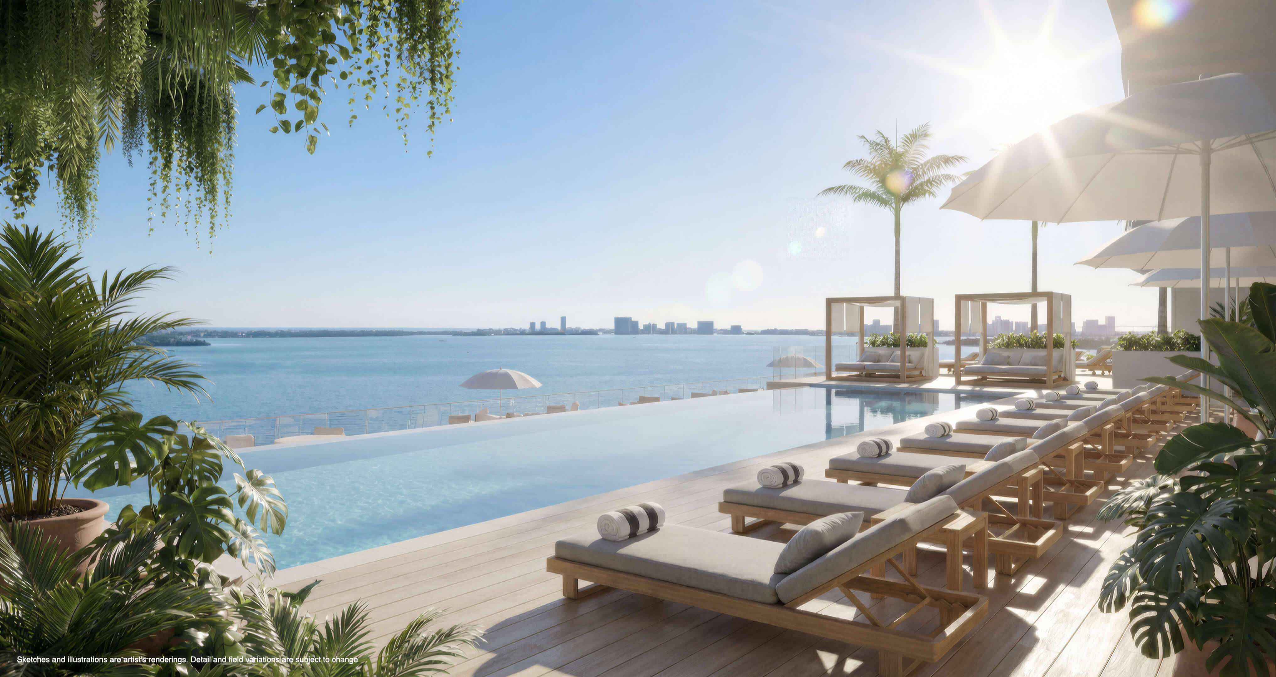 Infinity pool at Continuum 12000 North Miami with luxury loungers and panoramic Biscayne Bay views