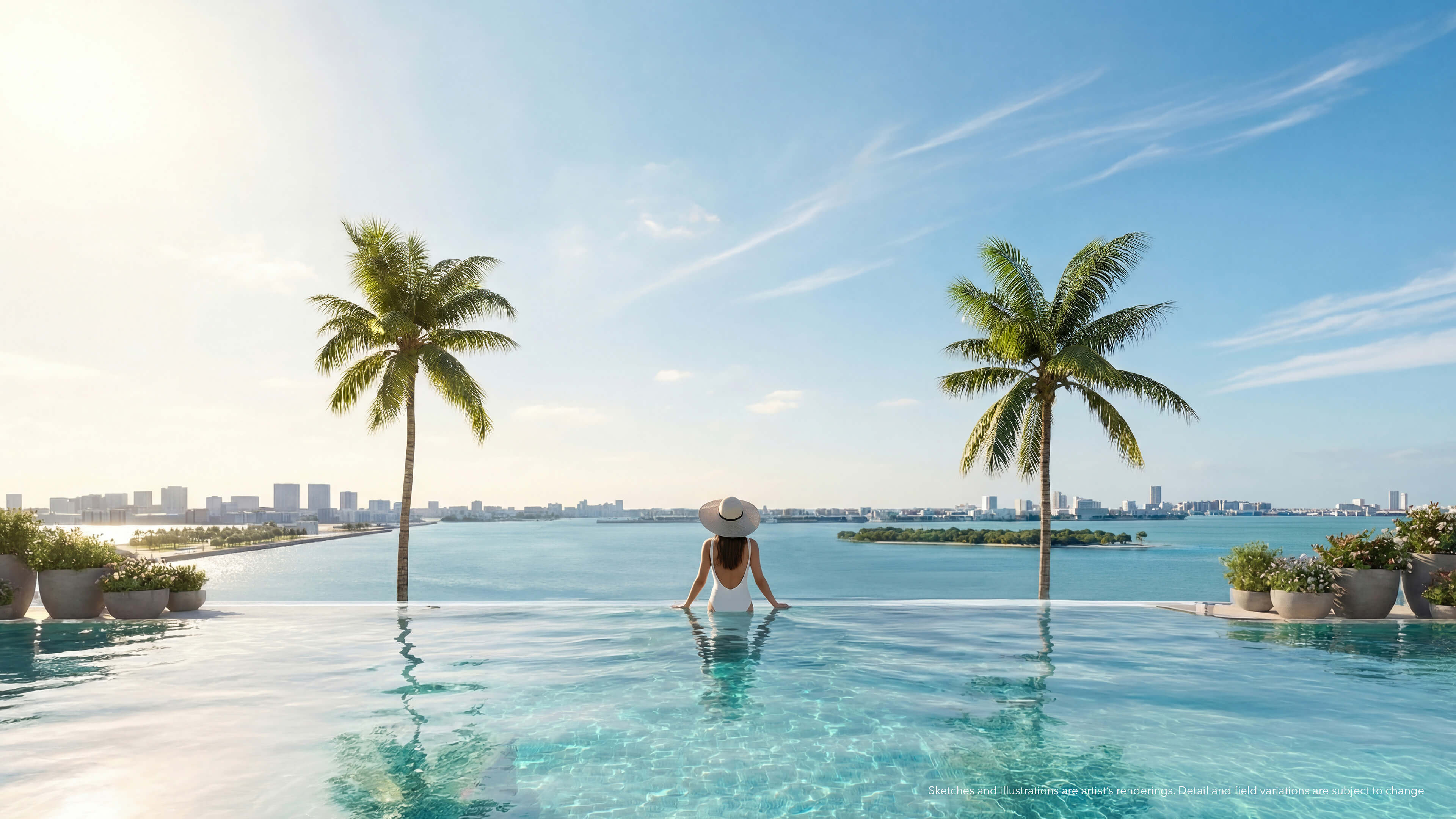 Waterfront infinity pool at Continuum 12000 North Miami with palm trees and expansive bay views