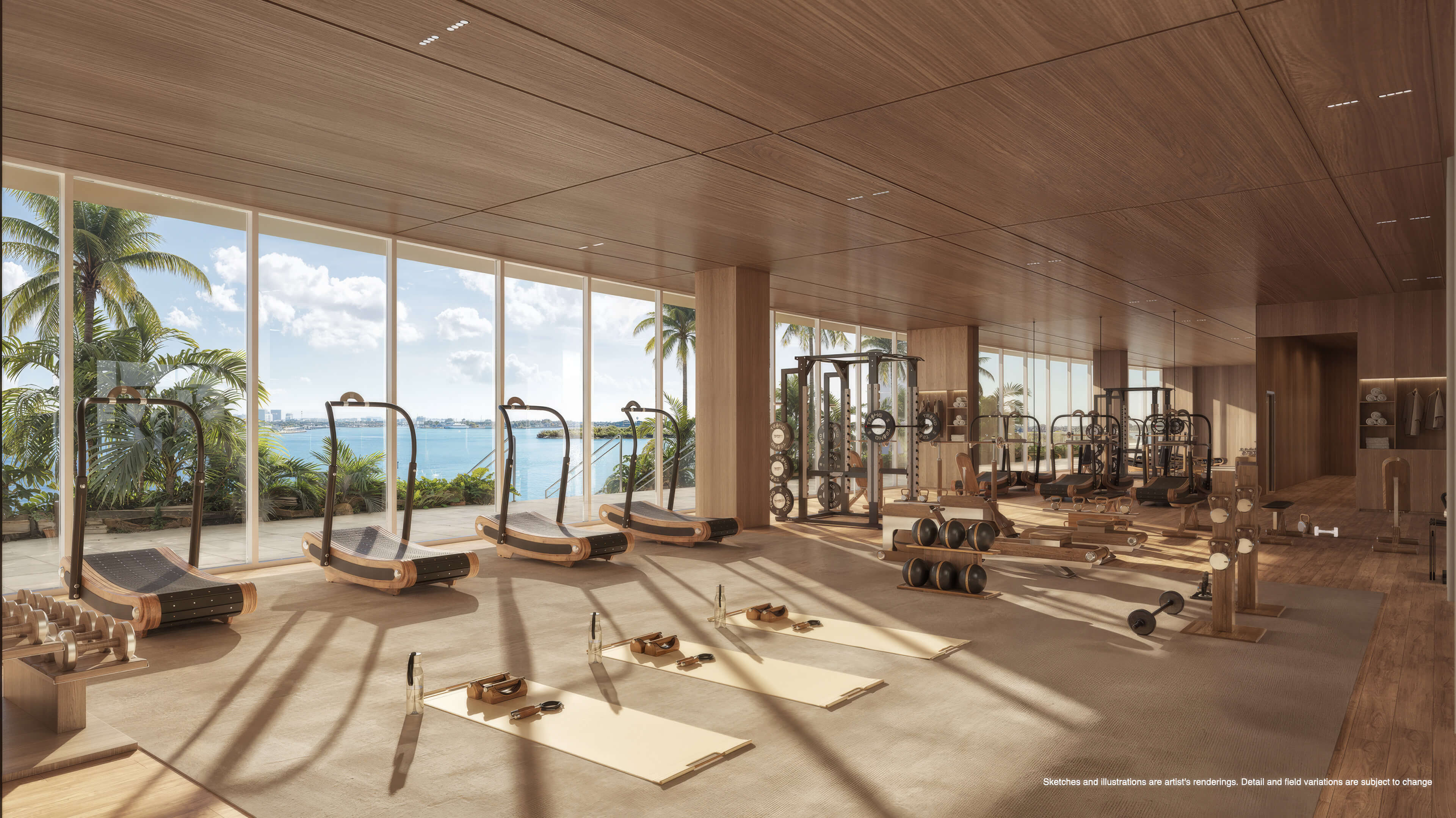 Waterfront fitness center at Continuum 12000 North Miami with cardio and strength training equipment