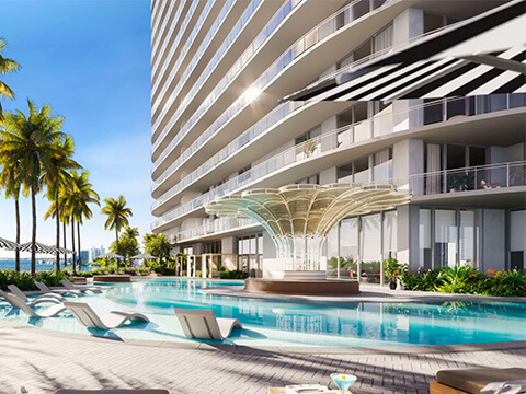 Curved pool deck architecture at Continuum Club & Residences featuring modern design and waterfront setting