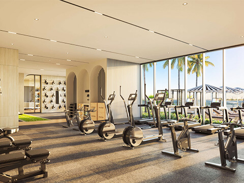 State-of-the-art fitness center at Continuum Club & Residences featuring modern equipment and natural light
