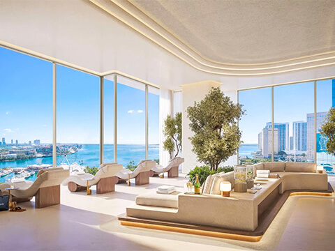 Sky lounge amenity at Delano Residences Miami with panoramic windows, seating, and bay views