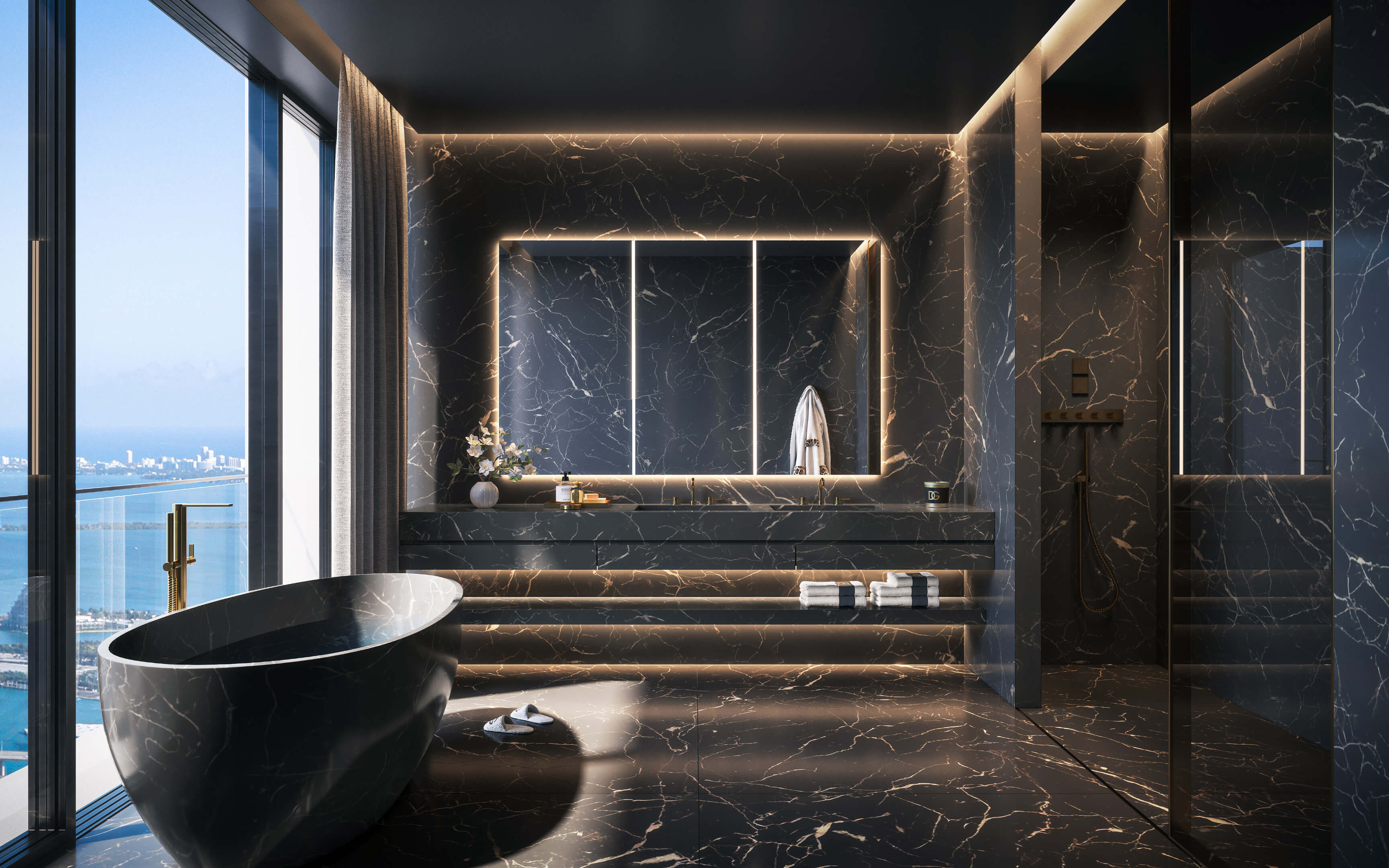 Sleek black marble bathroom with freestanding tub at 888 Brickell Ave overlooking Biscayne Bay