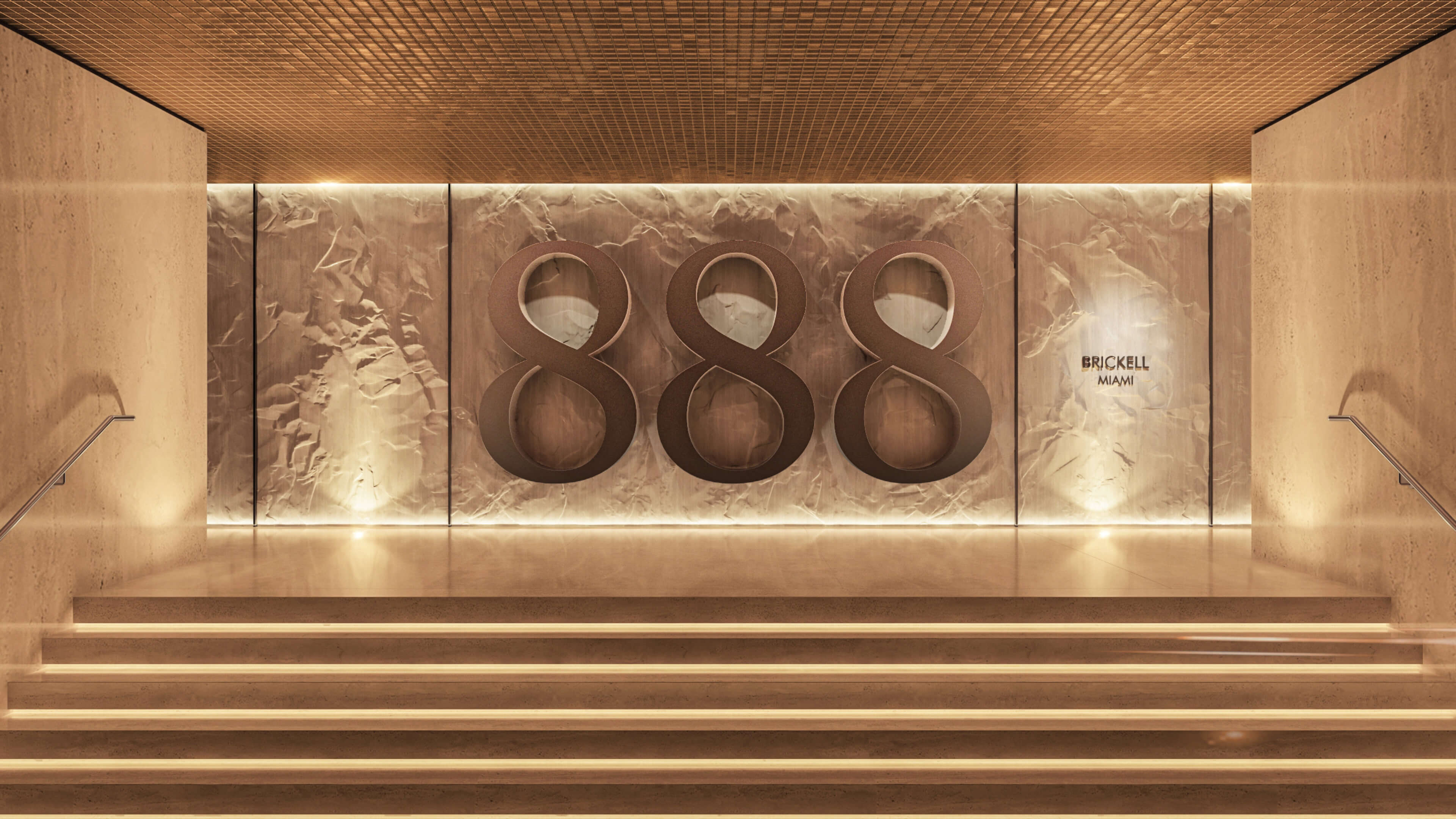 Grand entrance of 888 Brickell Ave featuring elegant design and signature branding