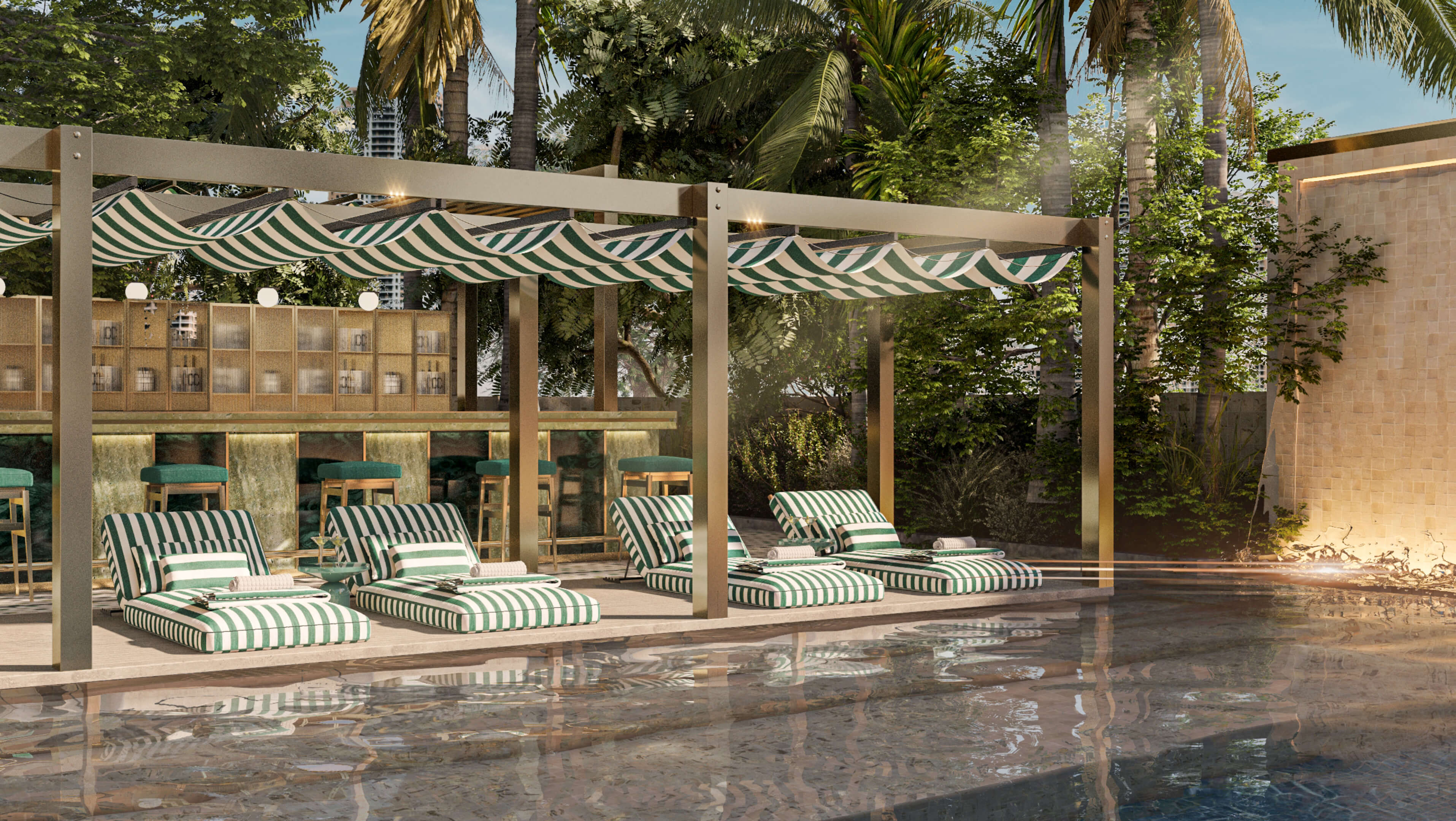 Poolside bar and striped daybeds at 888 Brickell Ave surrounded by palm trees and privacy