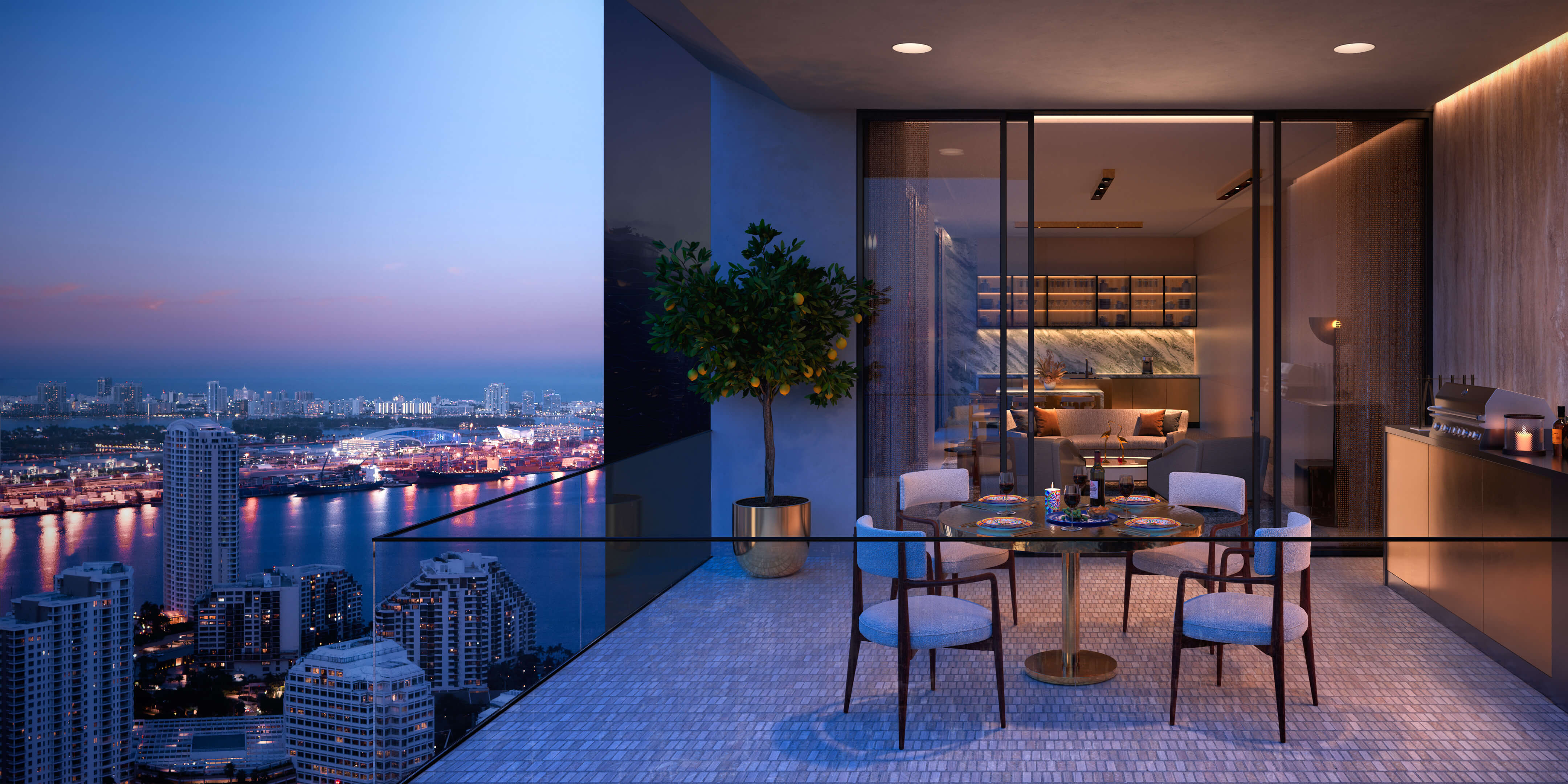 Private balcony at Dolce & Gabbana Residences with Miami city view at dusk and outdoor dining