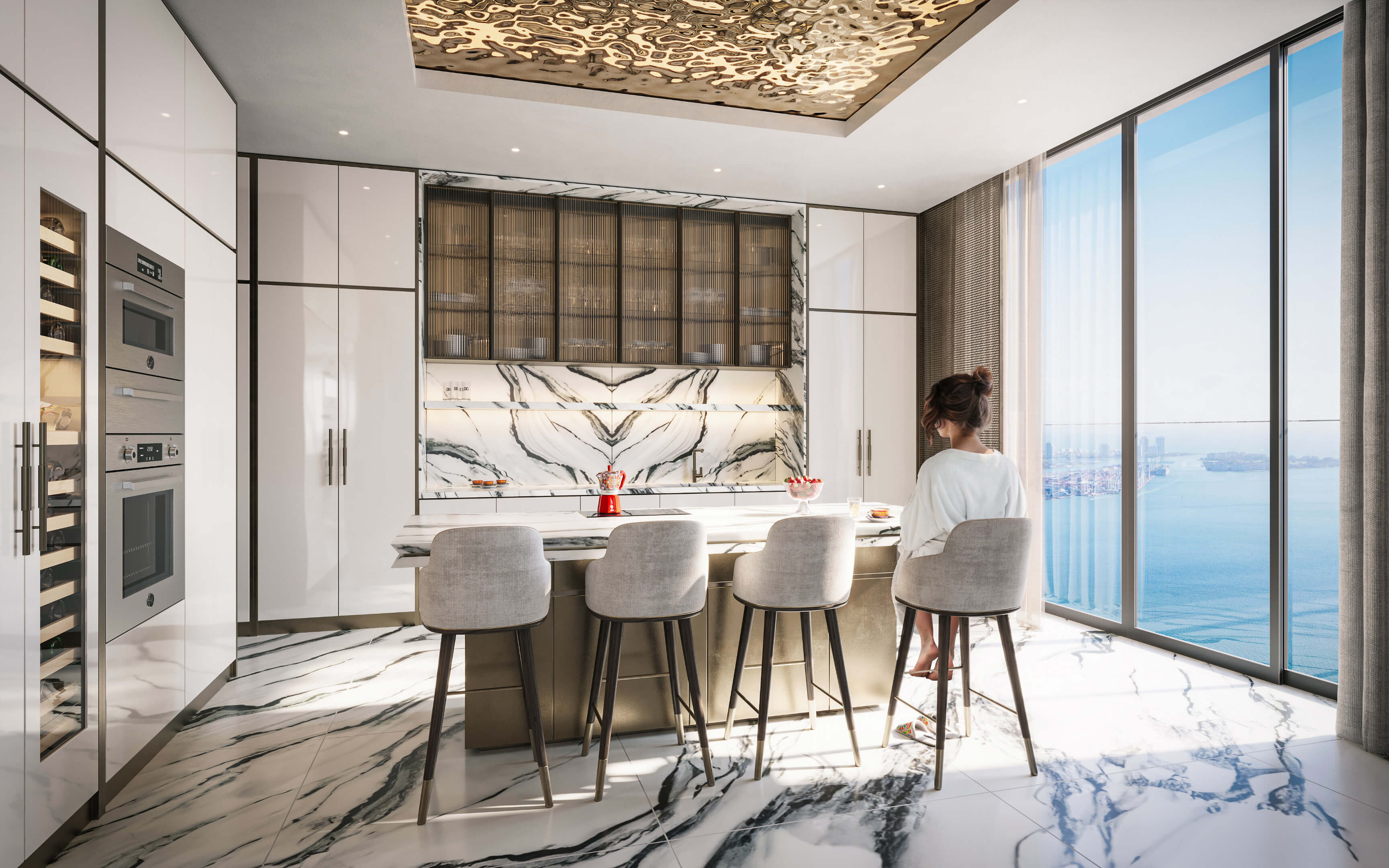 Bright white marble kitchen at Dolce & Gabbana Residences with ocean views and elegant design