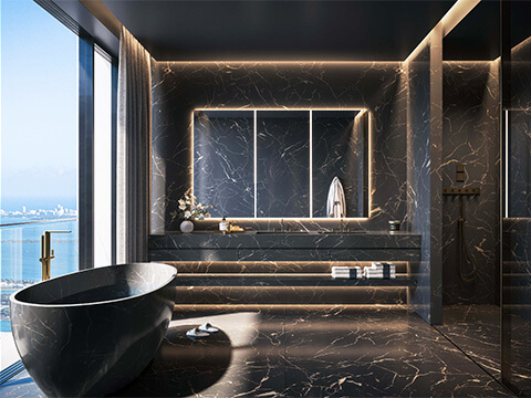 Black marble bathroom with tub at 888 Brickell D&G Residences