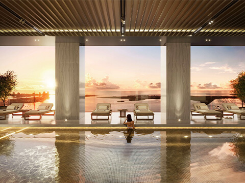 Indoor pool with sunset ocean view at 888 Brickell D&G Residences