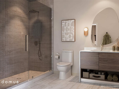 Modern bathroom at Domus Brickell Center with glass shower, sleek vanity, and contemporary lighting design