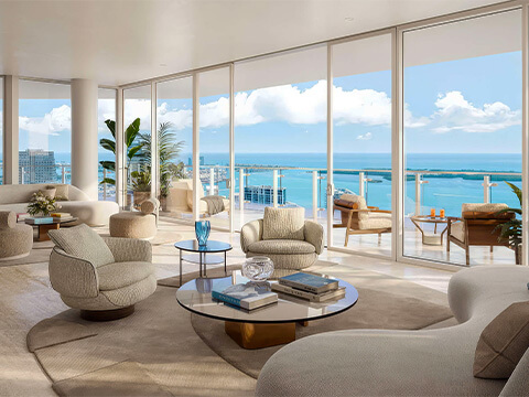 Luxury living room at Faena Residences Miami with floor-to-ceiling windows and expansive Miami bay views