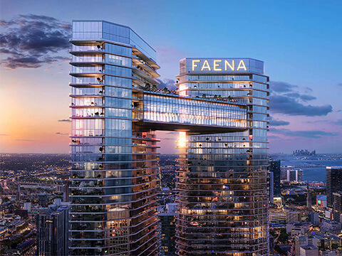 Faena Residences Miami skyline tower bridge at sunset with Miami bay and city lights