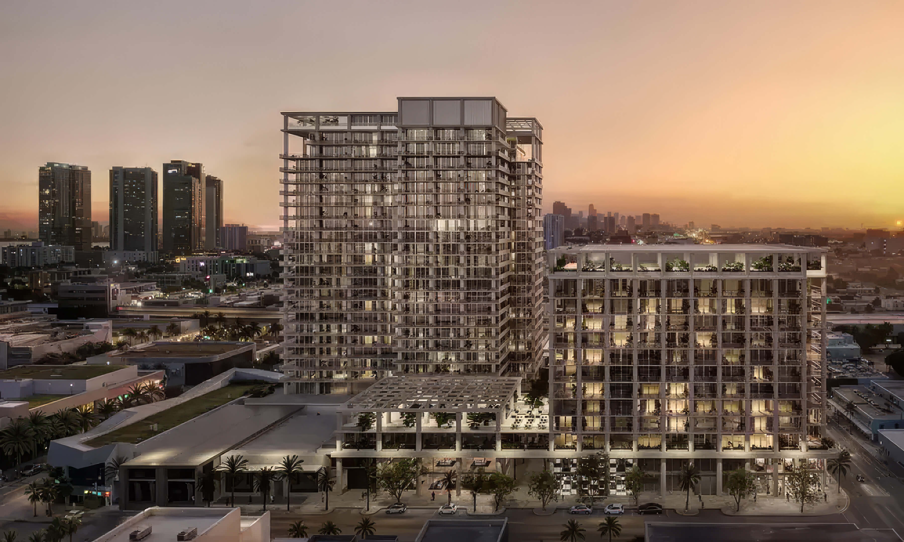 Aerial view of the towers at sunset with the surrounding city skyline at Fouquet’s Hotel & Residences