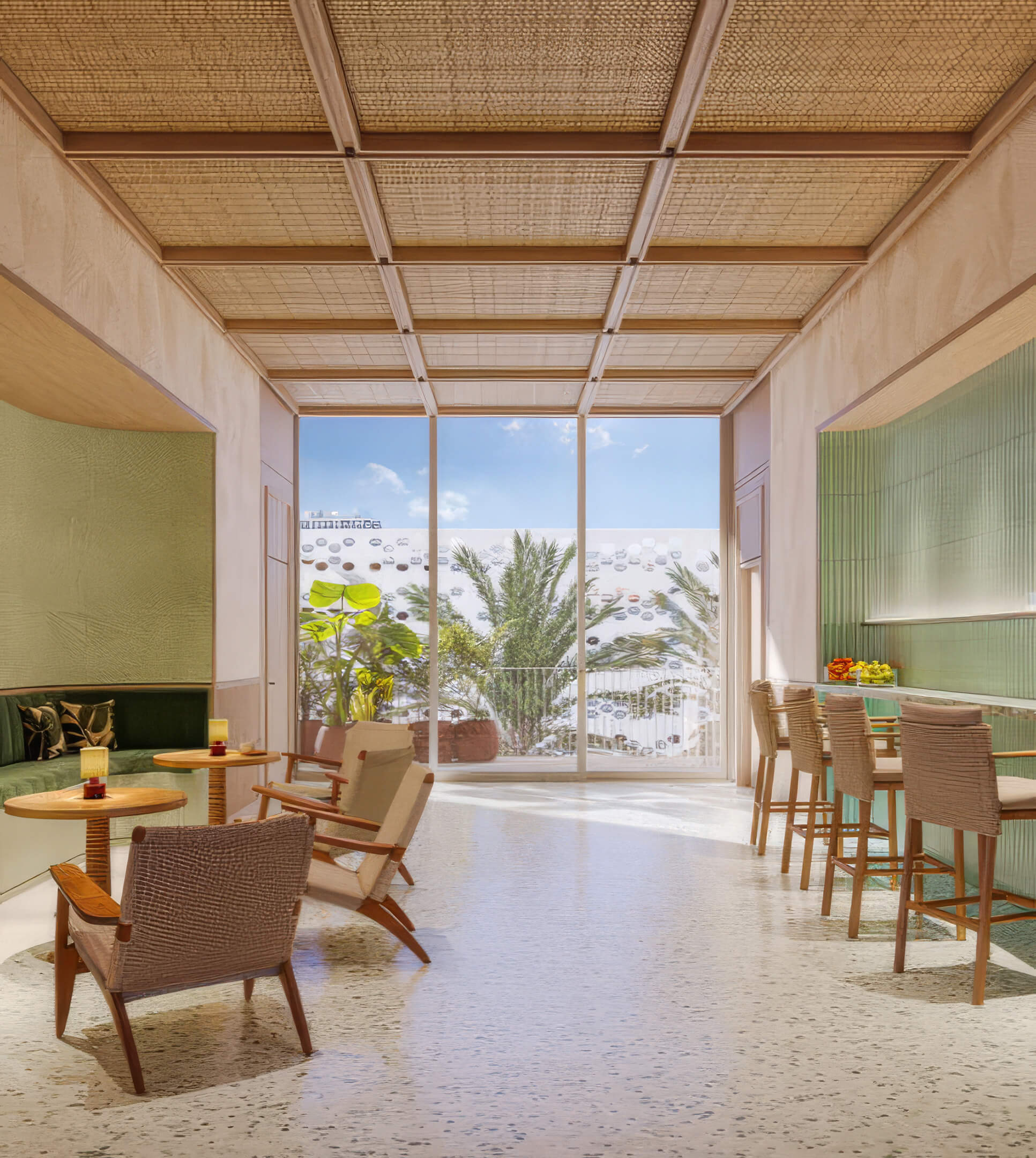 Green tile bar with woven chairs, a coffered ceiling, and doors opening to a terrace at Fouquet’s Hotel & Residences