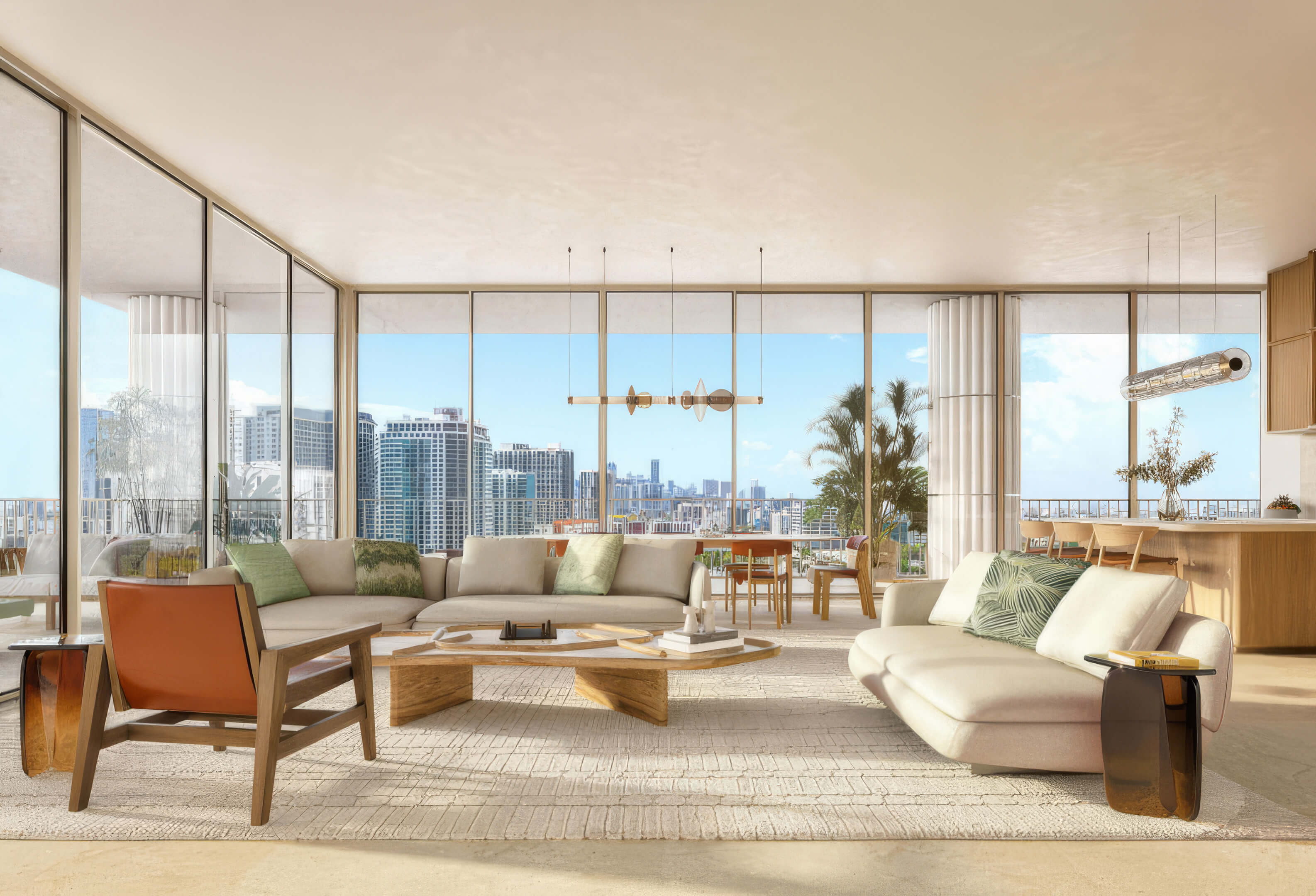 Living room with cream sofas, green cushions, and panoramic city views at Fouquet’s Hotel & Residences