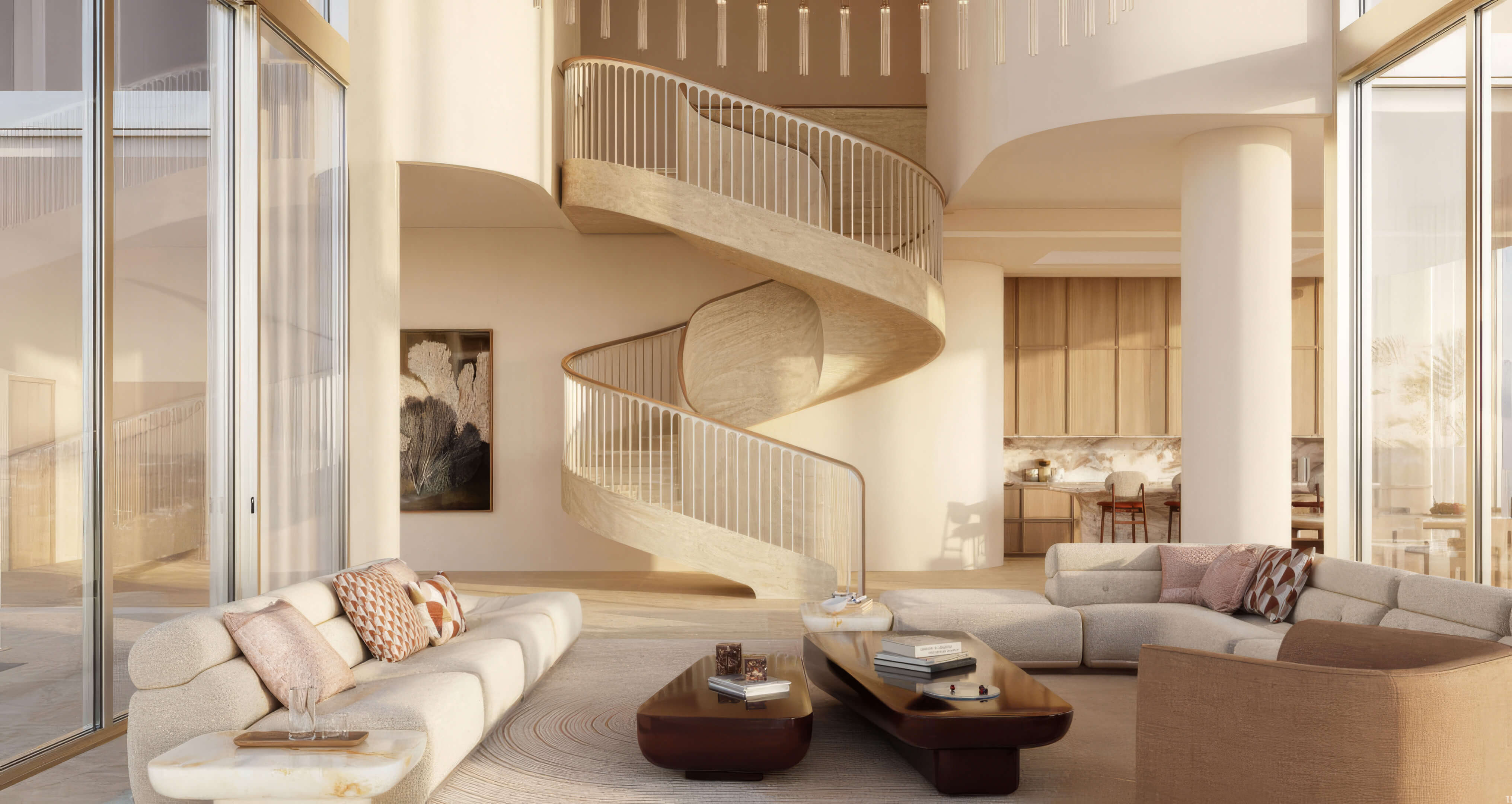 Living room with a sculptural spiral staircase, curved sofas, and an open kitchen at Fouquet’s Hotel & Residences