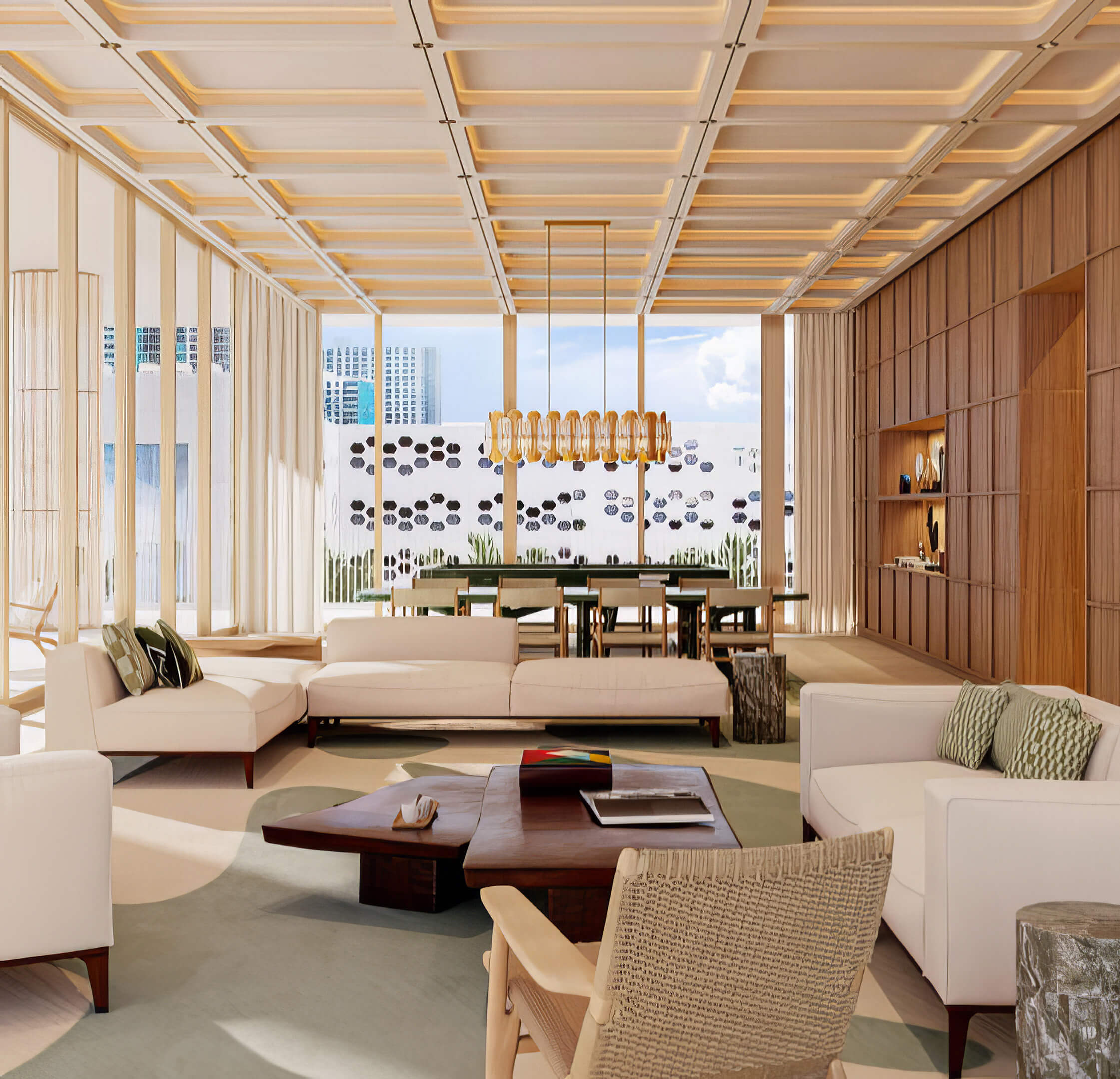 Lounge with cream sofas, a dining table, and an illuminated coffered ceiling at Fouquet’s Hotel & Residences