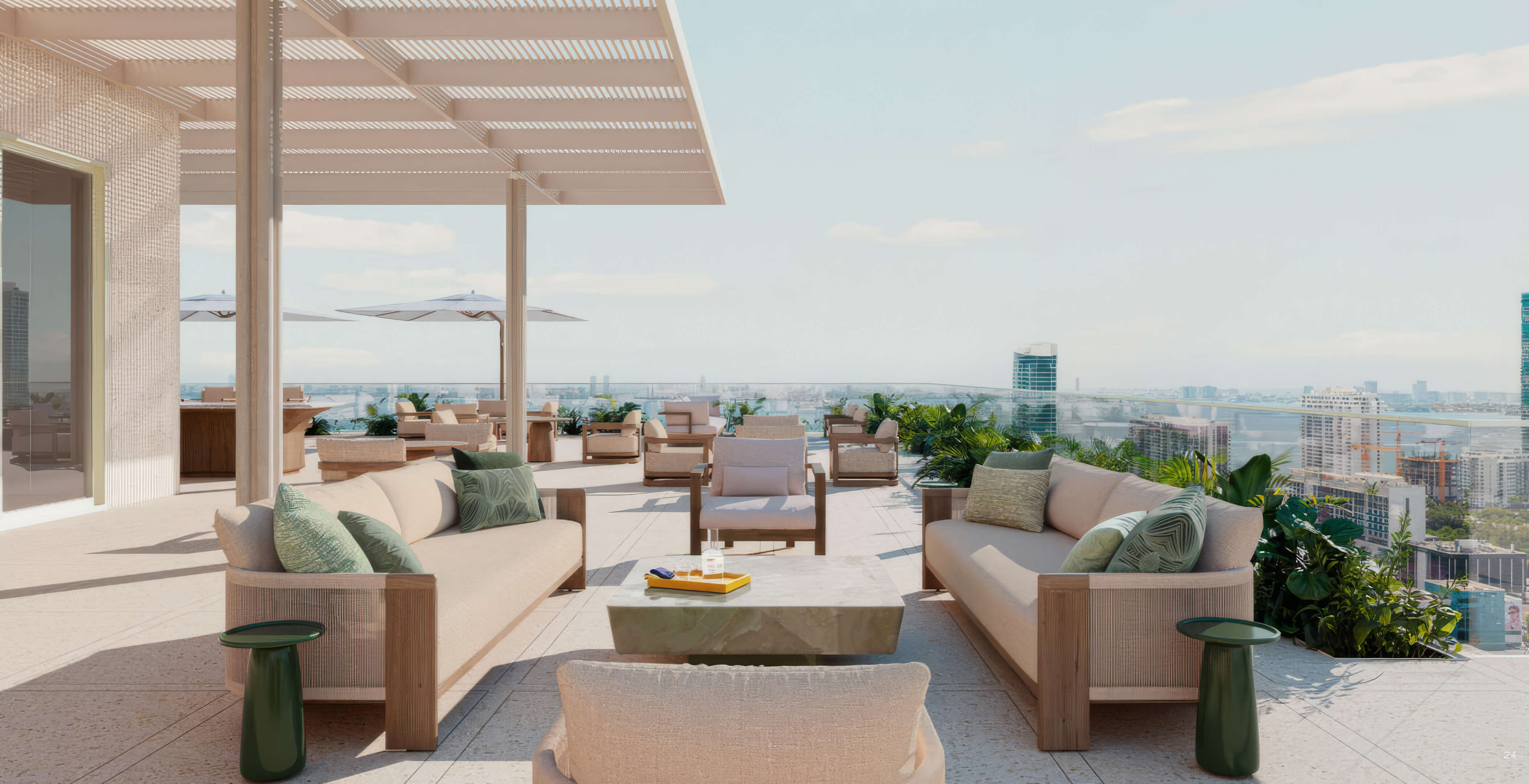 Rooftop terrace with outdoor sofas, planted borders, and expansive city views at Fouquet’s Hotel & Residences
