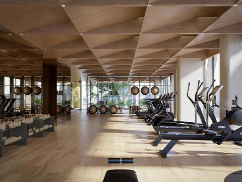 Fitness center at HQ Residences Edgewater with cardio machines, free weights, and expansive window views