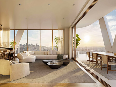 Luxury living area at HQ Residences Edgewater with sunset terrace, city skyline views, and modern furnishings