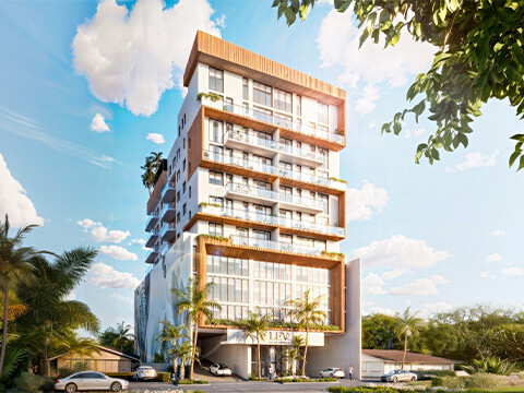 Front exterior view of LEV Residences Aventura Miami featuring modern architecture, glass balconies and tropical landscaping