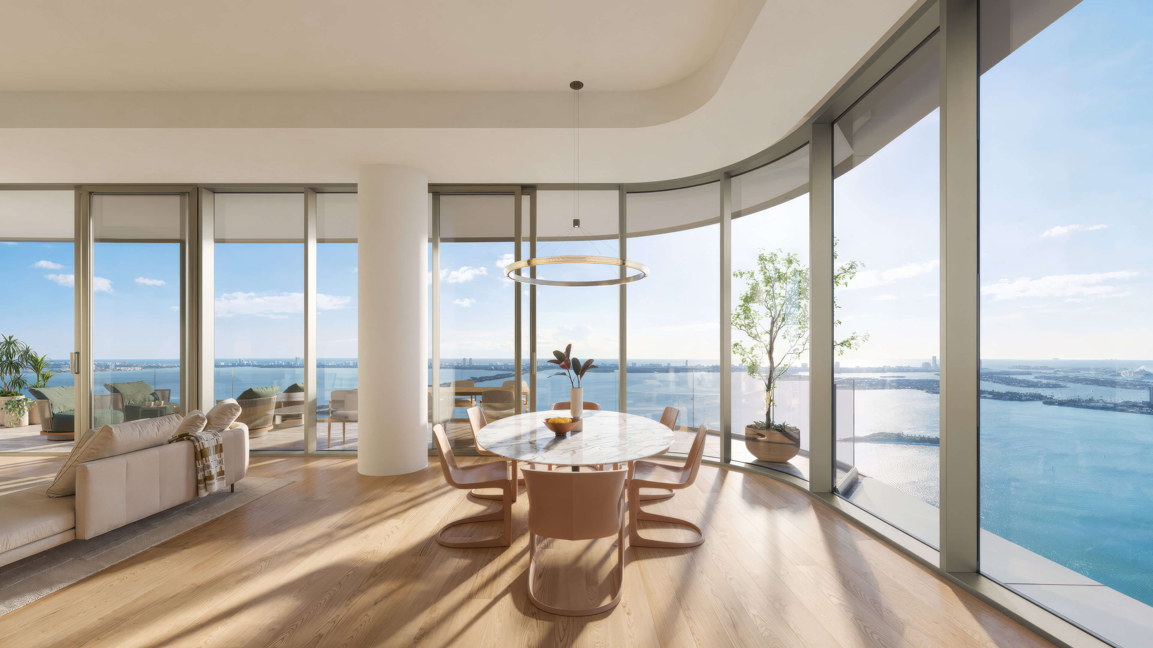 Dining room at Lilli Miami Edgewater with curved glass windows and panoramic bay views
