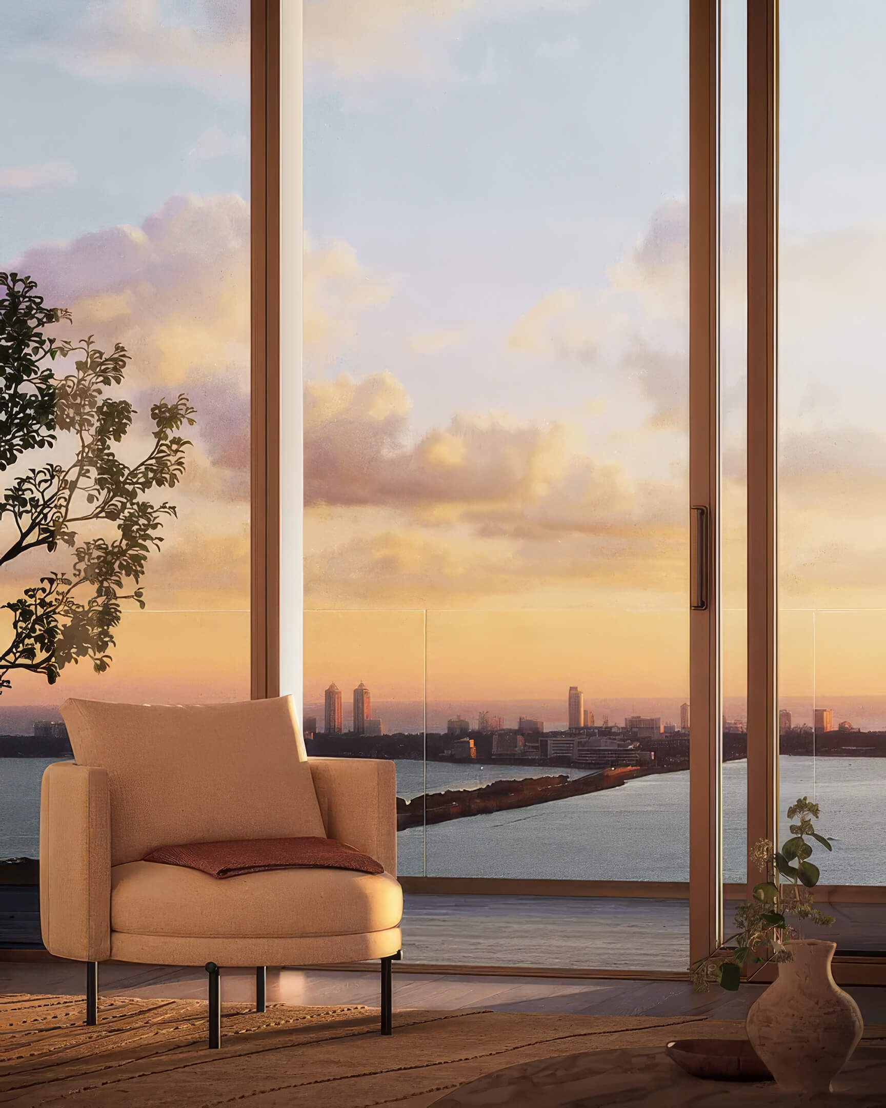 Armchair and side table at Lilli Miami Edgewater with sunset views through full height windows