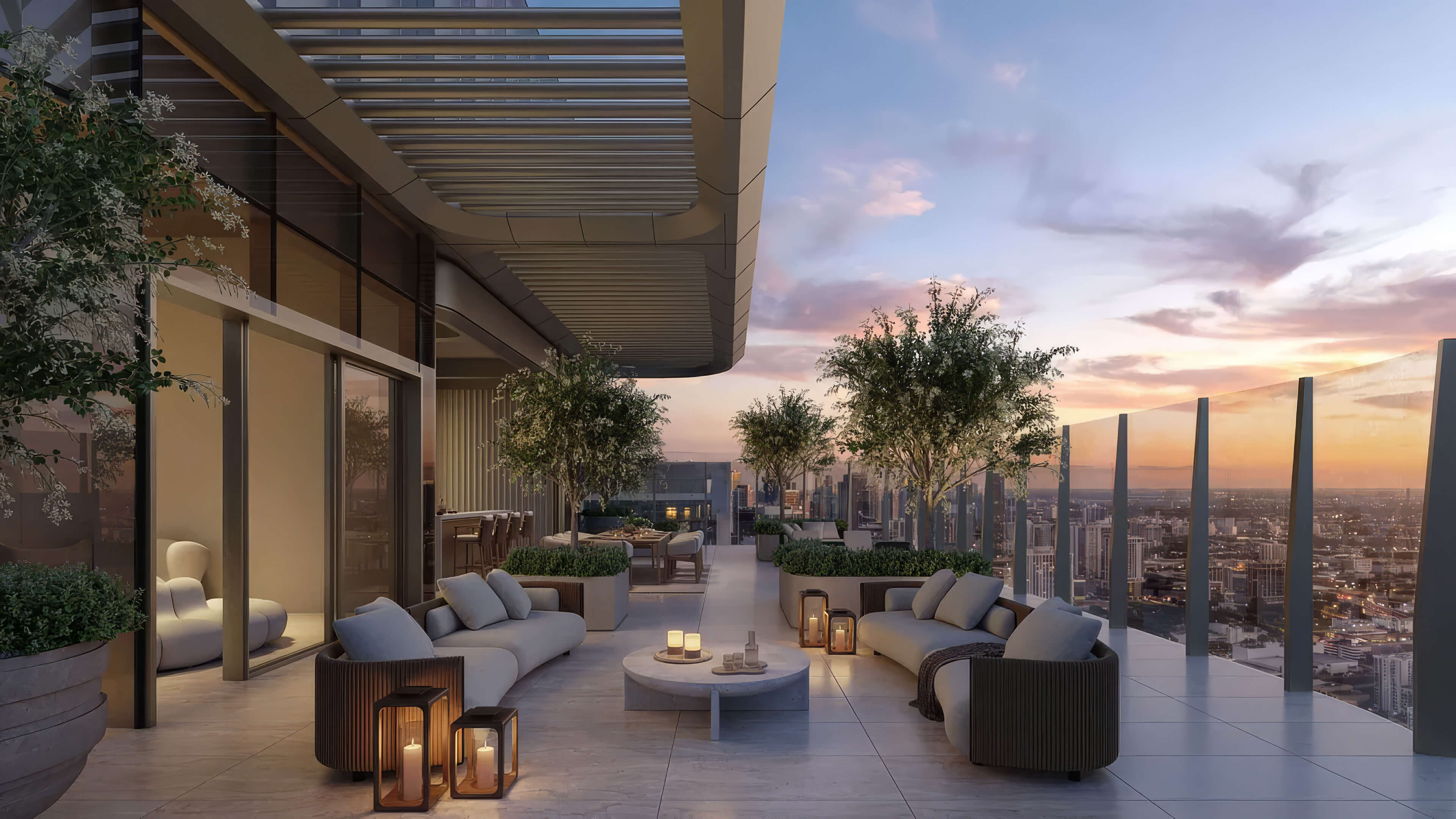 Outdoor lounge at Lilli Miami Edgewater with sofas, lanterns and sunset skyline views