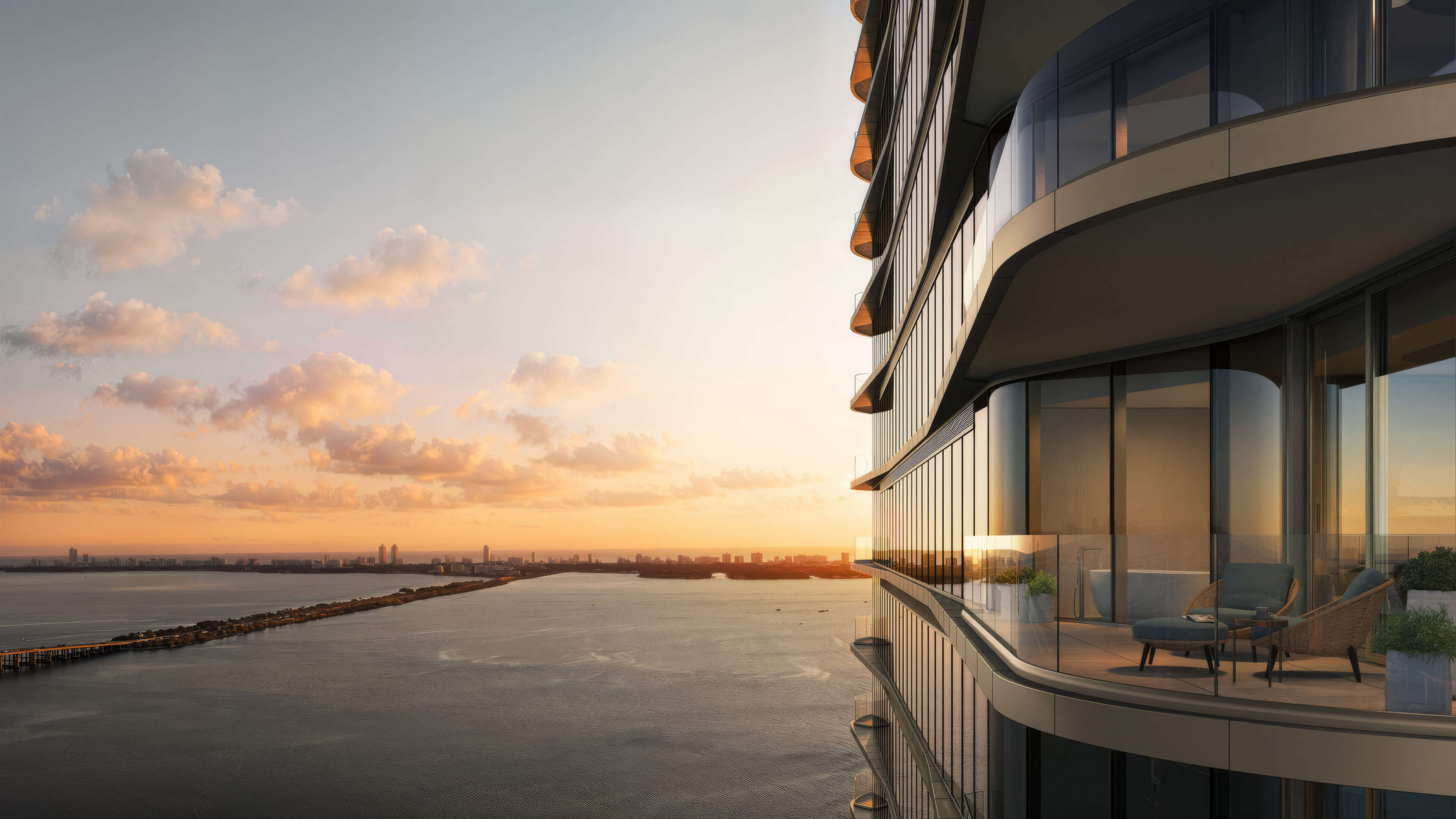 Private balcony at Lilli Miami Edgewater with sunset views over Biscayne Bay and Miami skyline