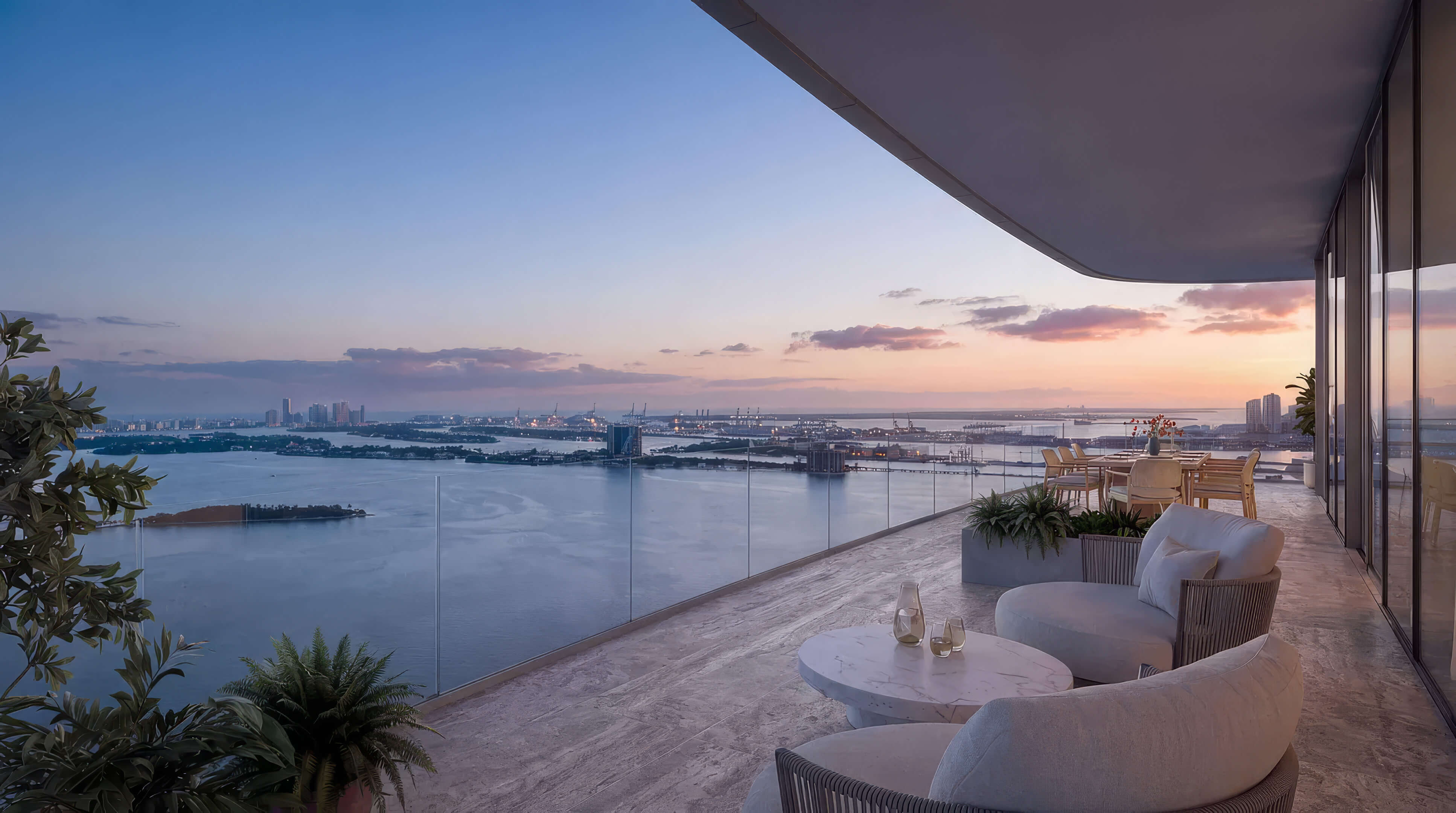Private balcony at Lilli Miami Edgewater with lounge seating and bay views at dusk