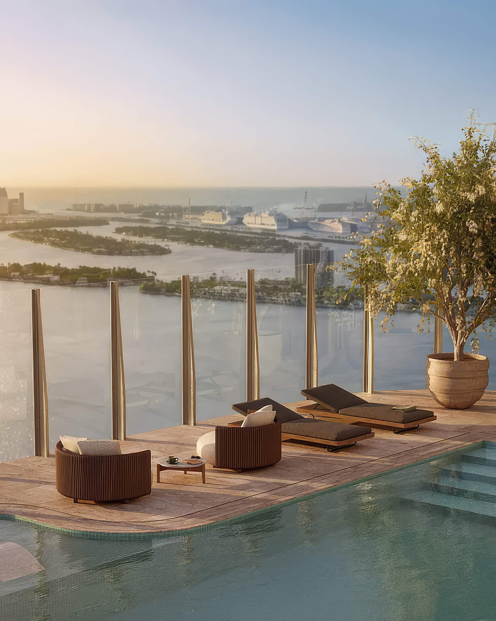 Poolside sun loungers at Lilli Miami Edgewater with glass railings and panoramic bay views