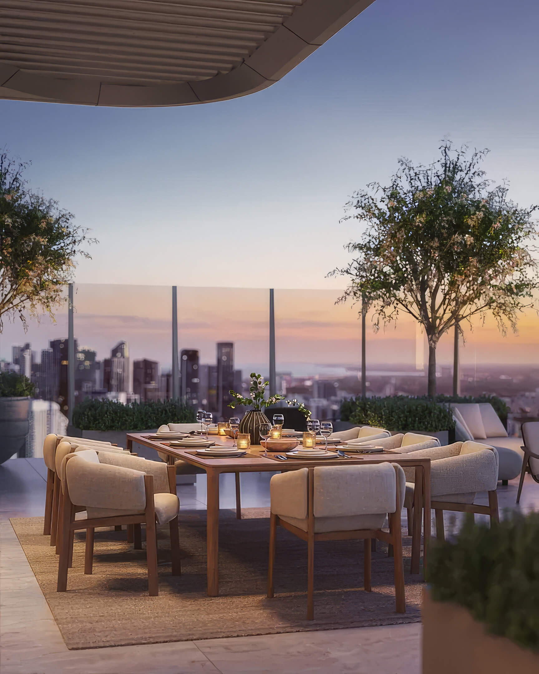 Outdoor dining table at Lilli Miami Edgewater with lounge seating and skyline views at dusk