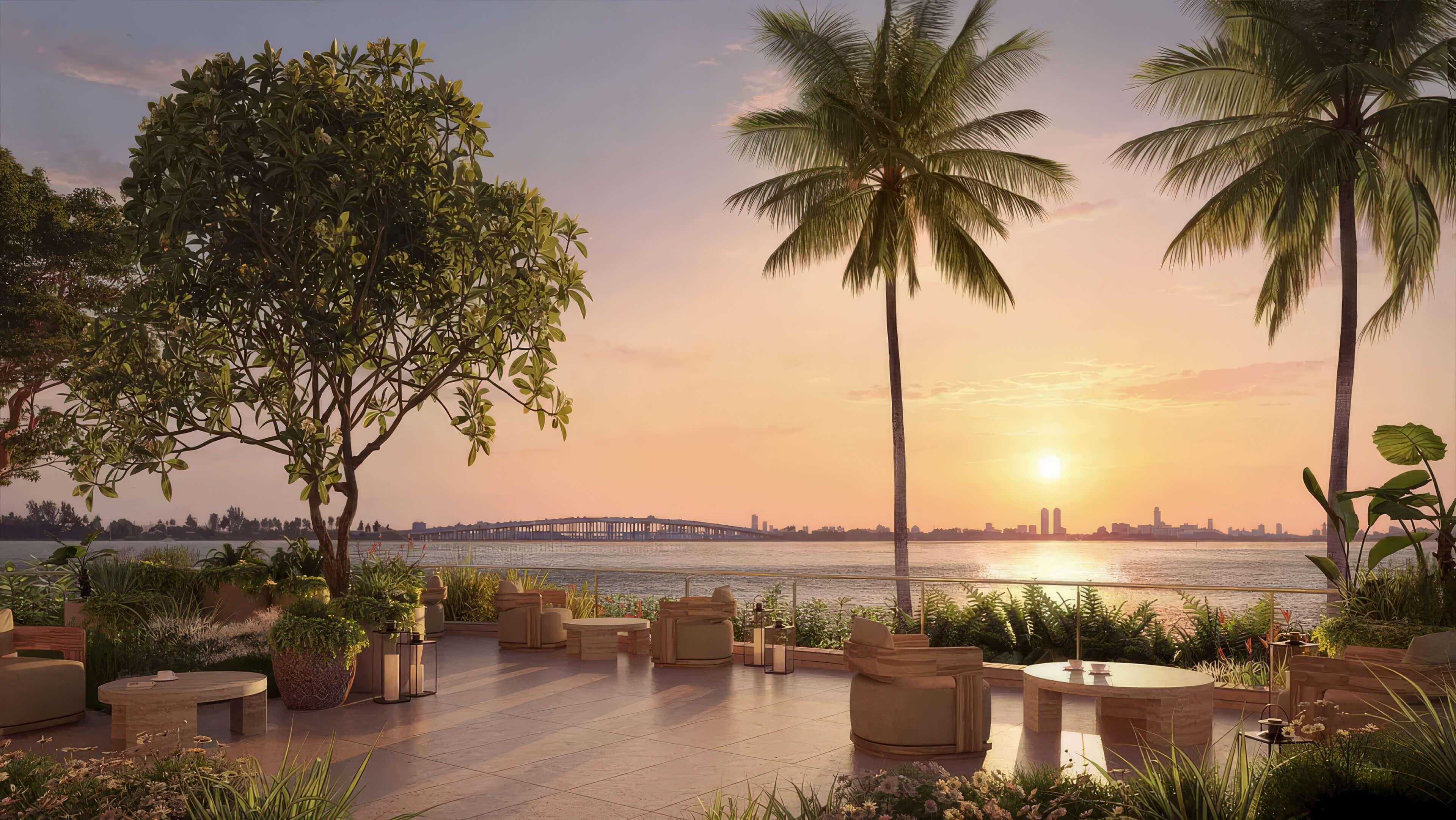 Waterfront garden at Lilli Miami Edgewater with palms, outdoor seating and sunset views over the bay