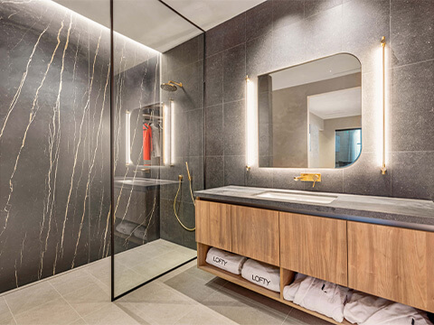 Lofty Residences Brickell modern bathroom with dark tiles