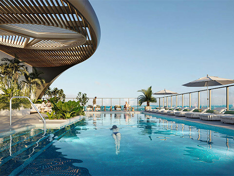 Mercedes Benz Places Miami rooftop swimming pool with luxury lounge chairs and panoramic views