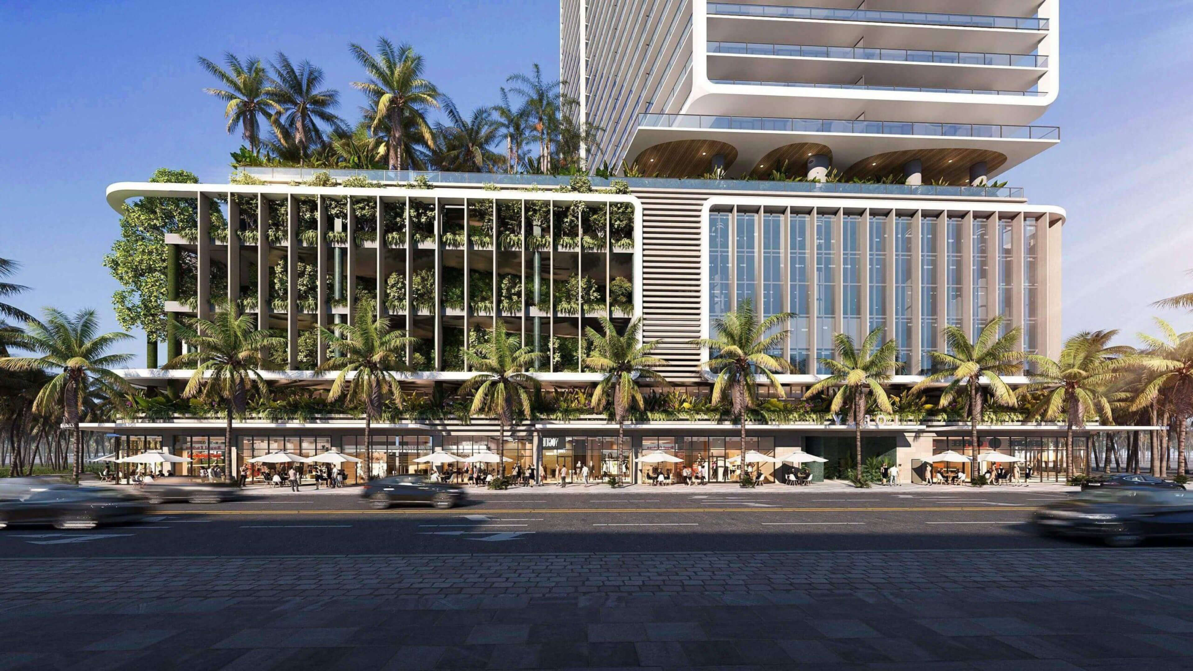 Green wall and tropical palm trees at Miami Tropic Residences luxury building