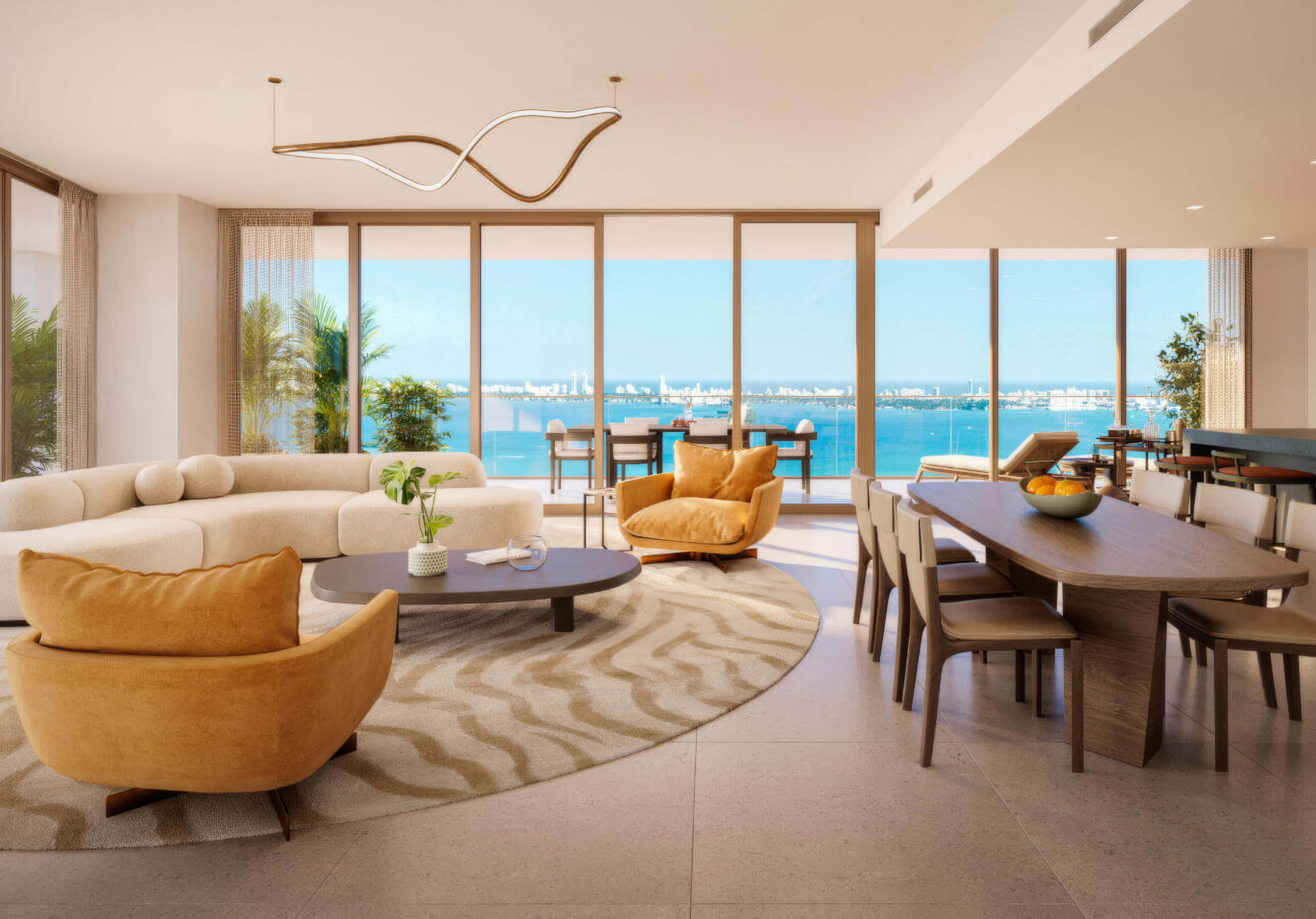 Luxury dining and living room with unobstructed bay views at Miami Tropic Residences