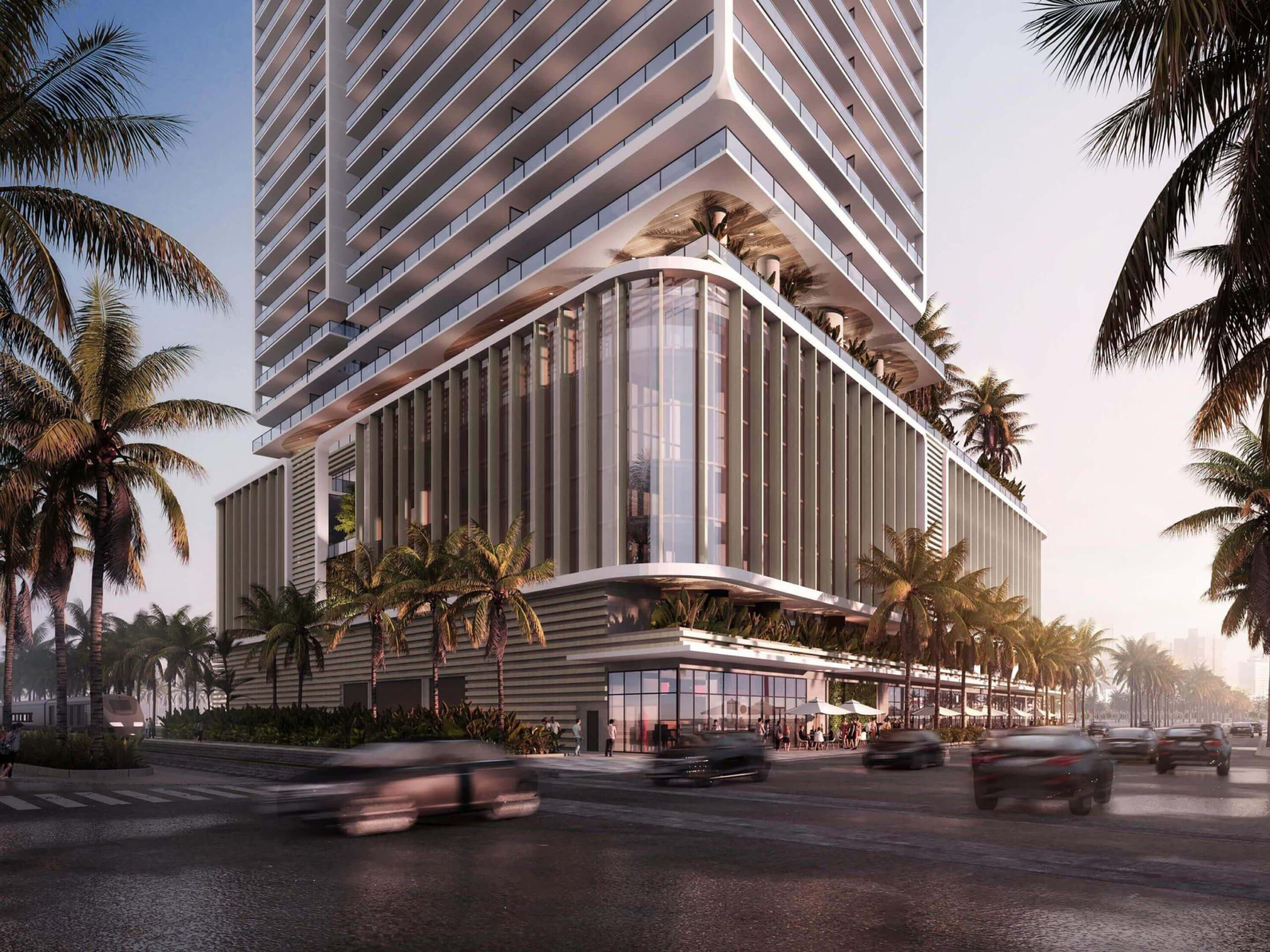 Modern architecture corner view of Miami Tropic Residences with palm trees and street life