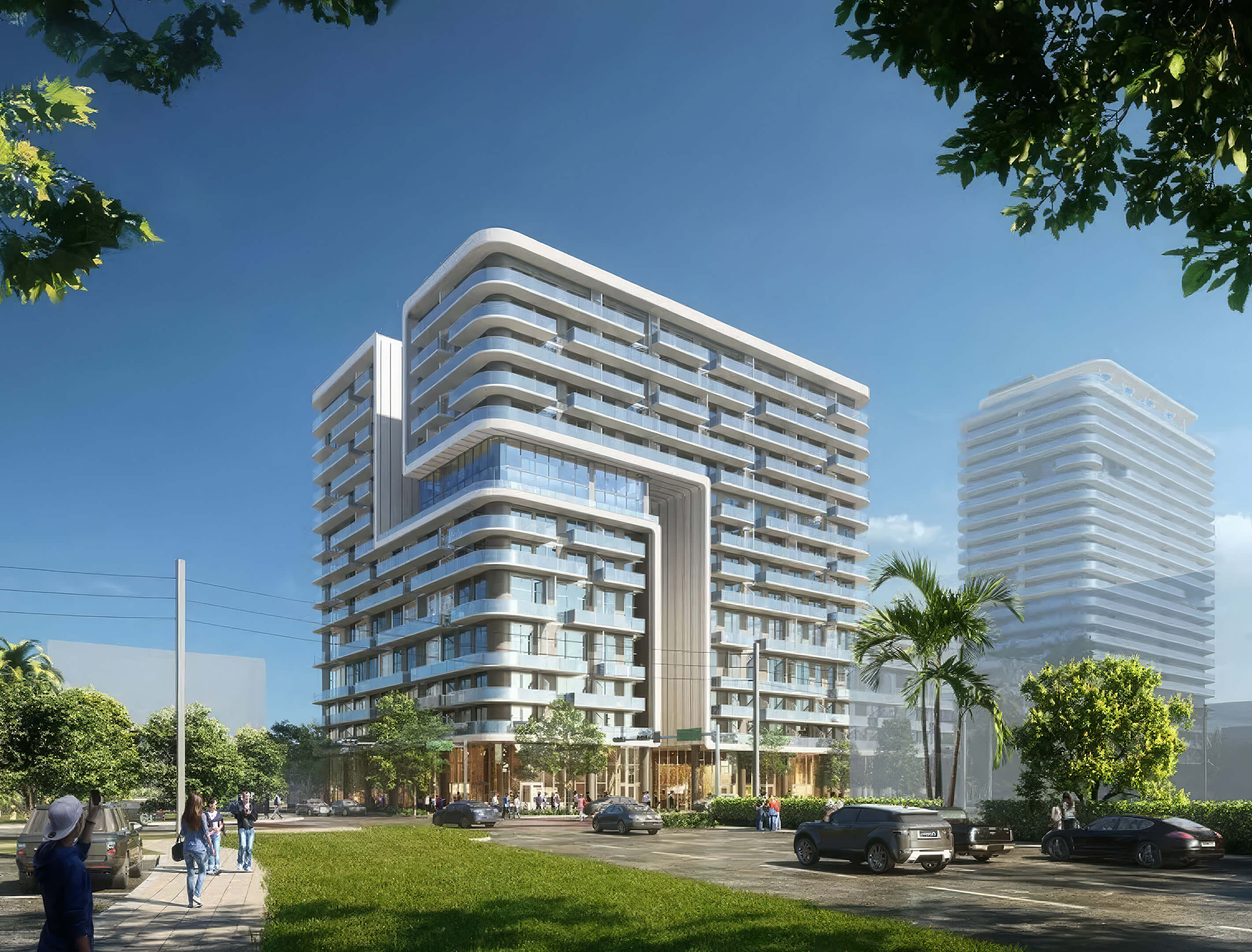 Modern exterior view of NoBe Parc Miami Beach with glass balconies, contemporary architecture and landscaped street frontage