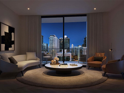 Evening living room at One Twenty Brickell Residences with balcony access and illuminated Brickell skyline views